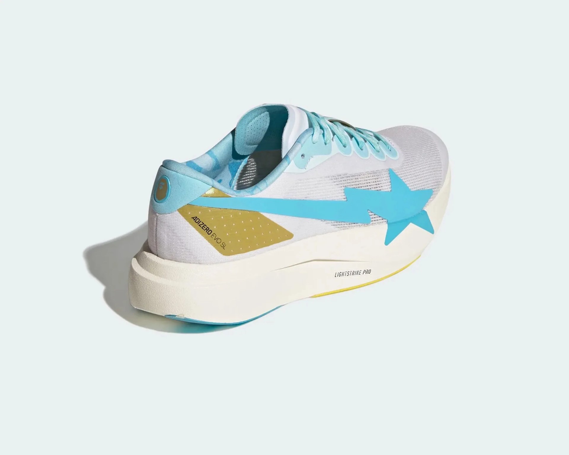 White and light blue Adidas Adizero Evo SL running shoe with a blue star and lightning bolt design on the side.