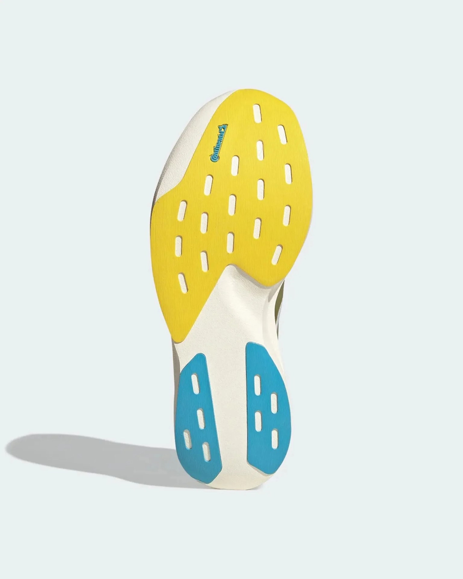 Shoe sole with yellow and blue rubber sections and Continental logo on a white base.