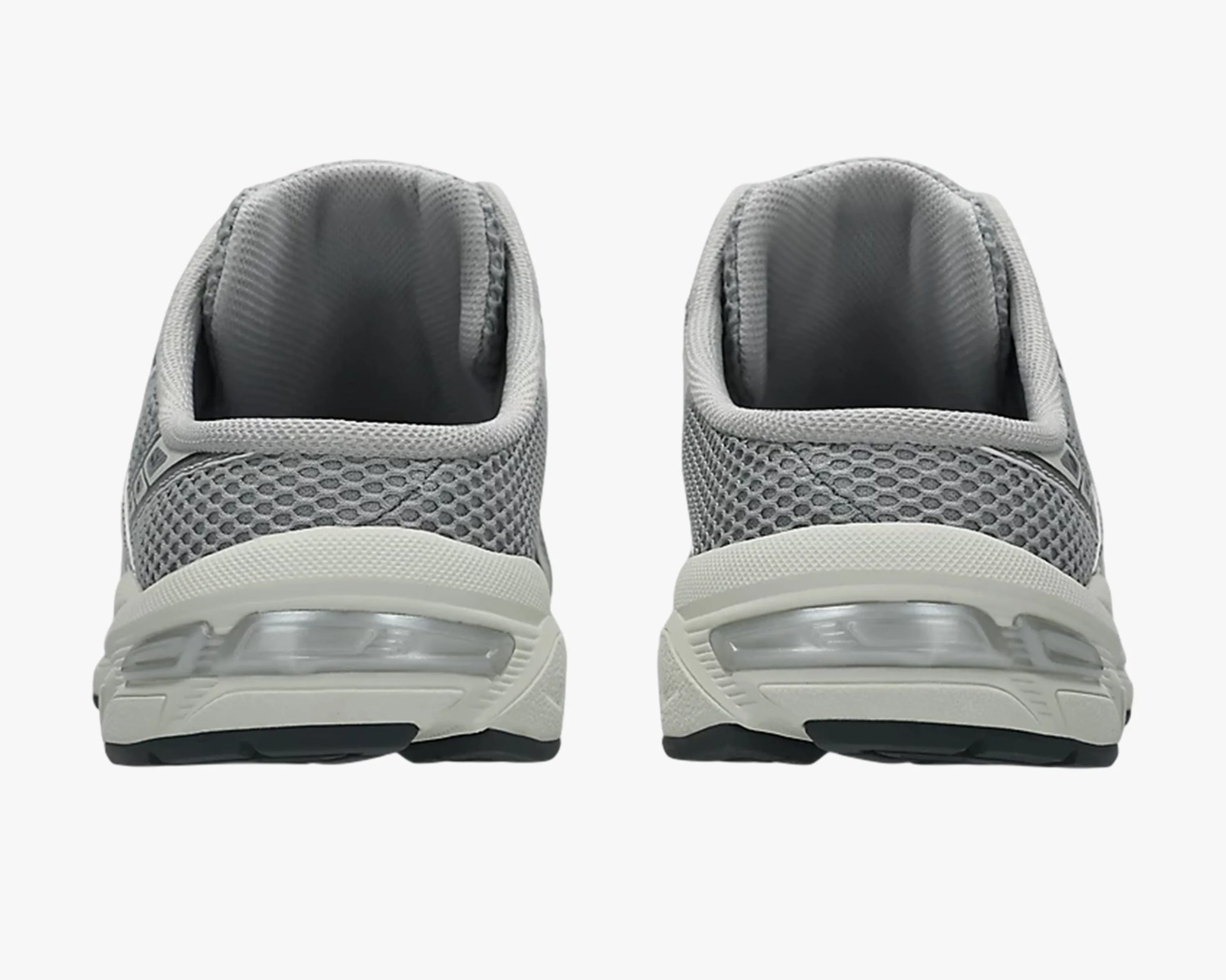 Pair of gray mesh sneakers viewed from the back showing padded collars and white midsoles with visible air cushioning.
