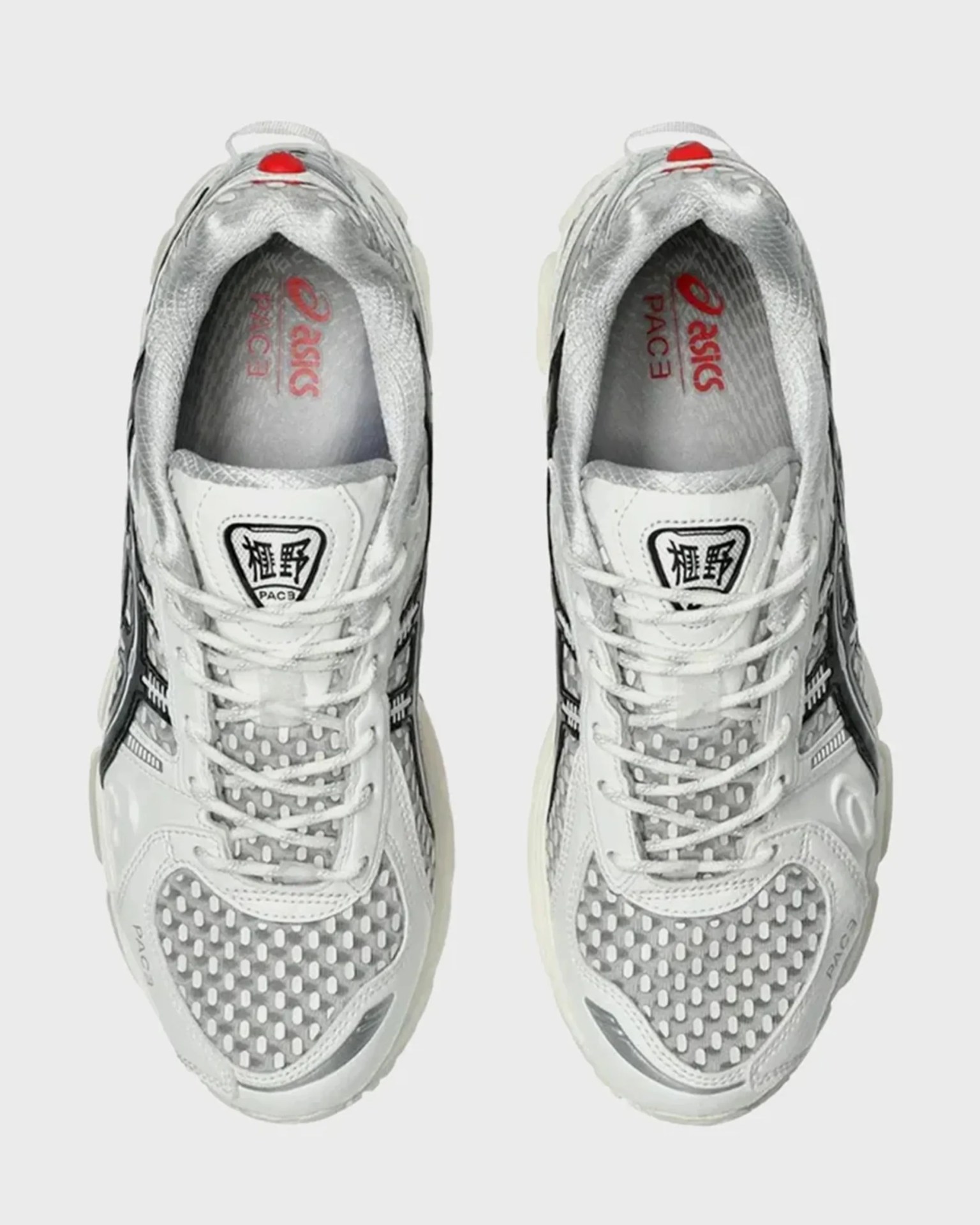 Pair of white and gray Asics PAC3 sneakers with mesh and leather uppers, viewed from above.
