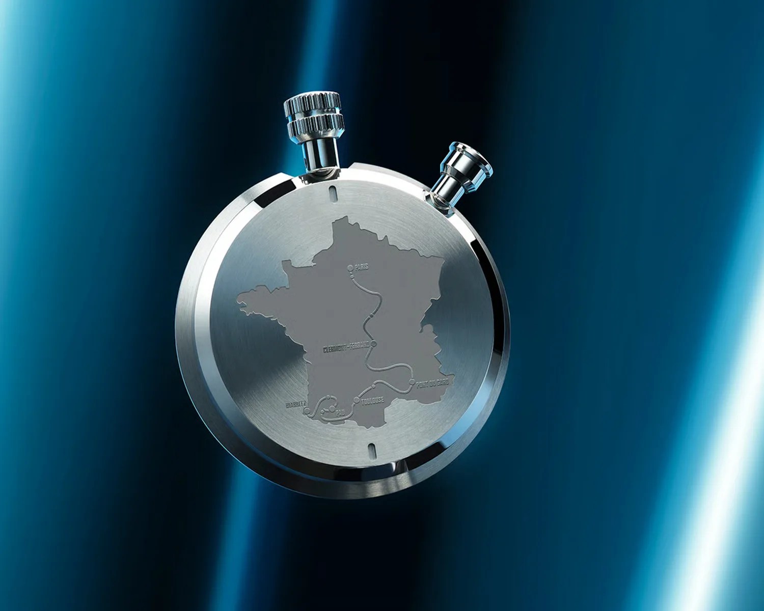 Round silver stopwatch with map of France and marked cities engraved on the back.