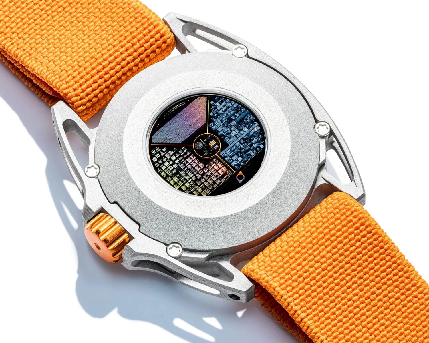 Silver watch case back with a visible microchip-like disc and orange woven fabric strap.