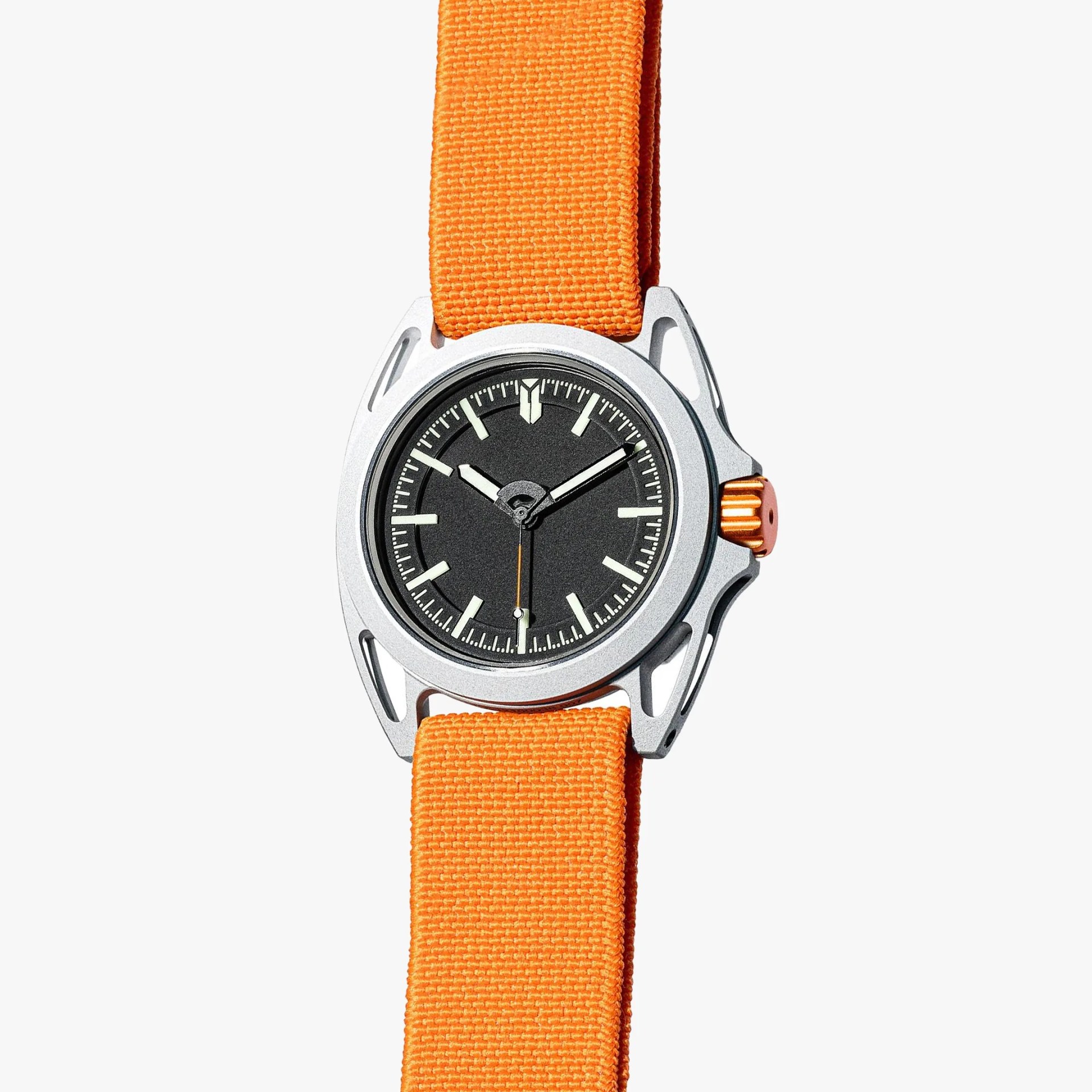 Silver watch with black dial, luminous markers, orange crown, and bright orange fabric strap.