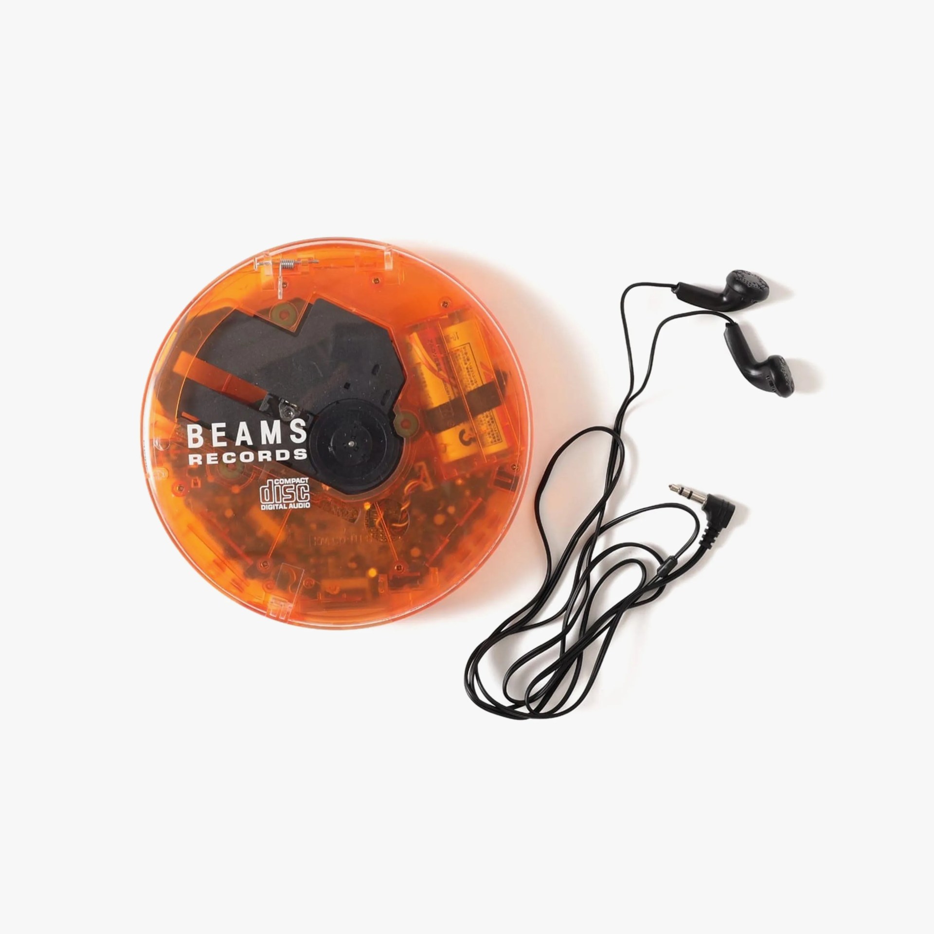Orange translucent portable CD player with black wired earbuds on a white background.