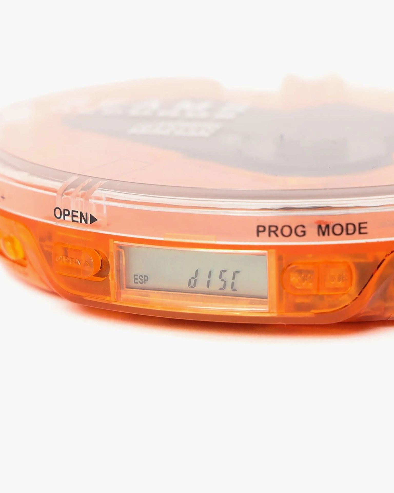 Orange translucent electronic device with a small LCD screen displaying "ESP d15C" and labeled buttons "OPEN" and "PROG MODE.