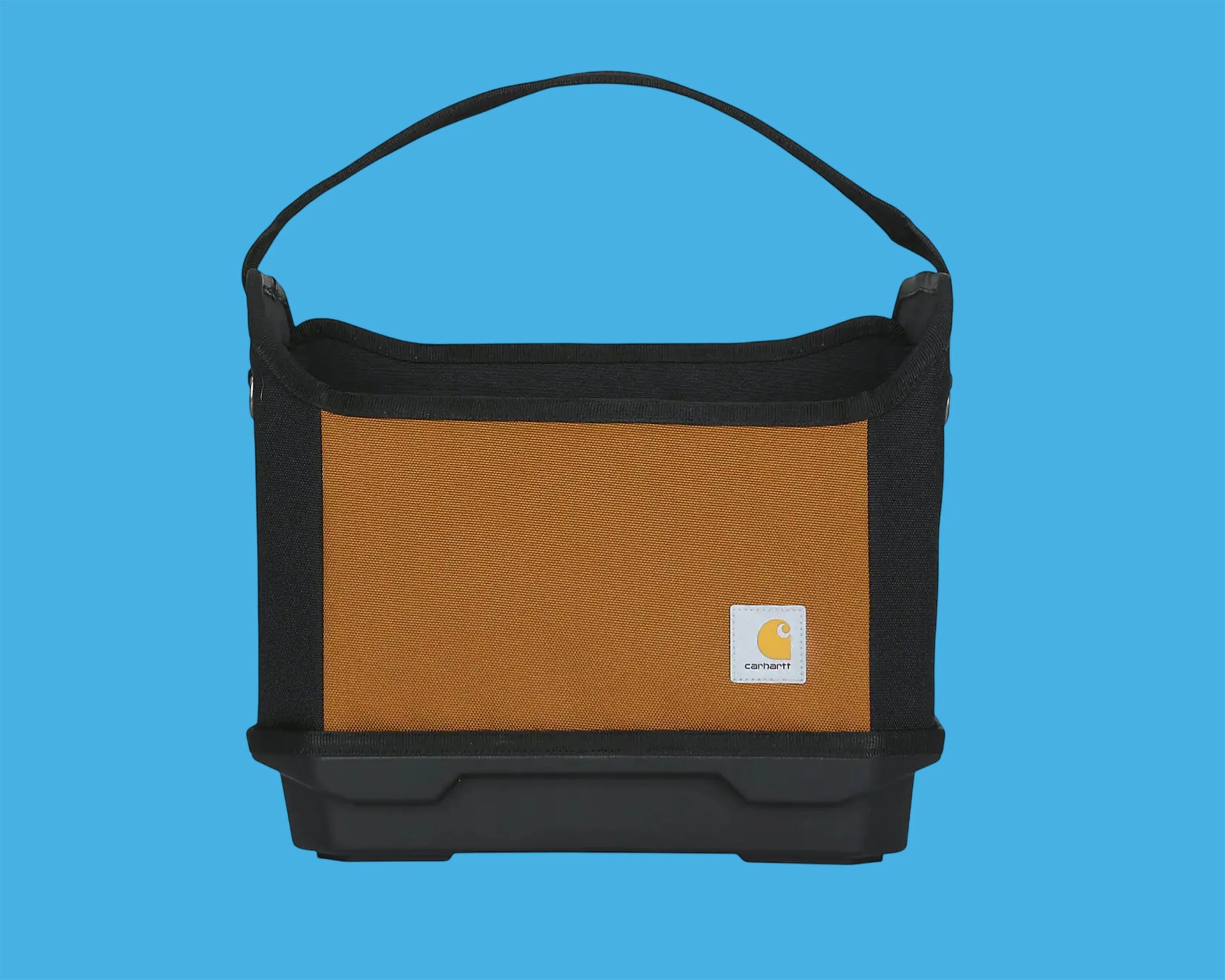 Brown and black Carhartt tote bag with a black handle and plastic base on a blue background.