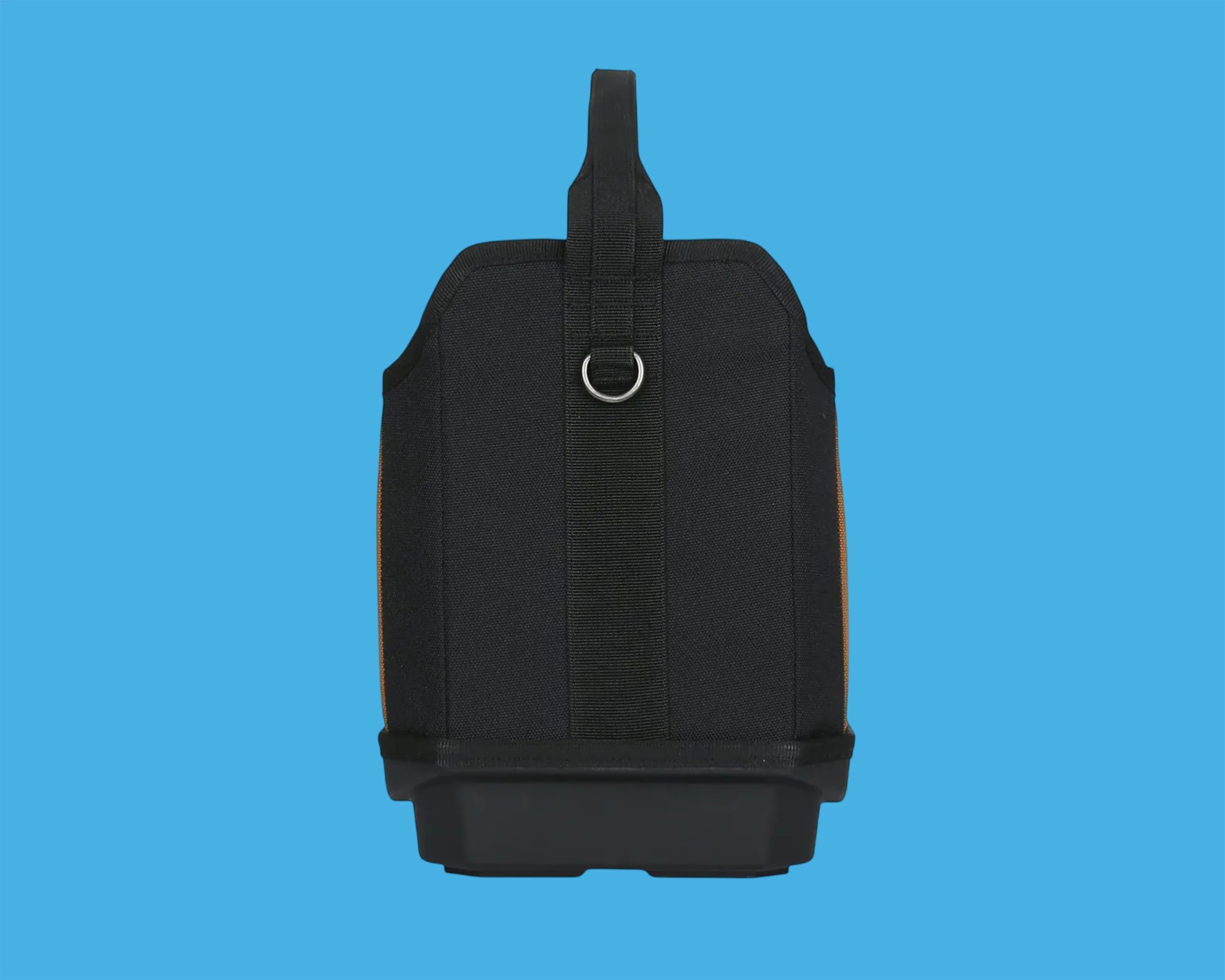 Black fabric bag with a vertical strap and metal ring on a blue background.