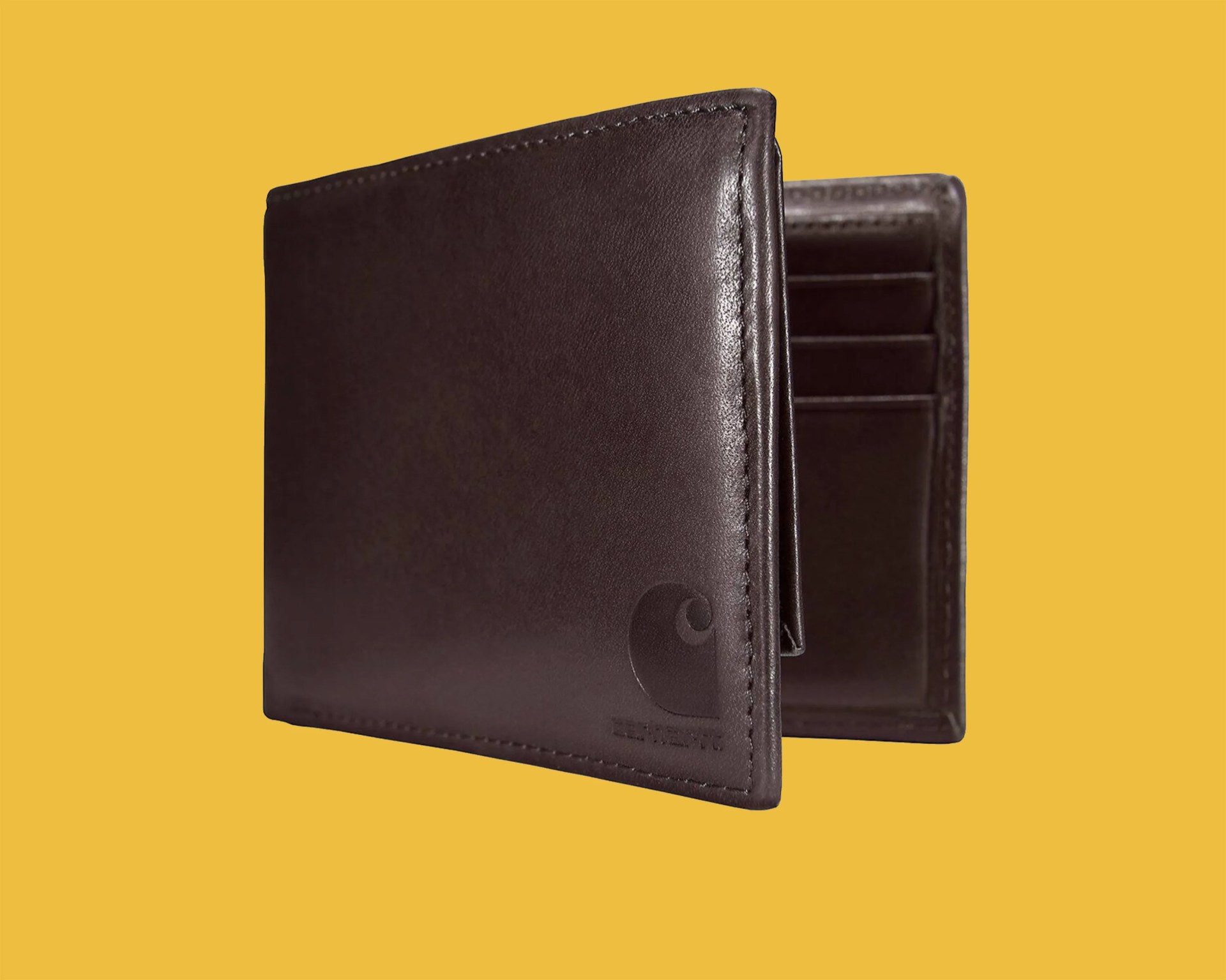 Dark brown leather bifold wallet with visible card slots inside on a yellow background.