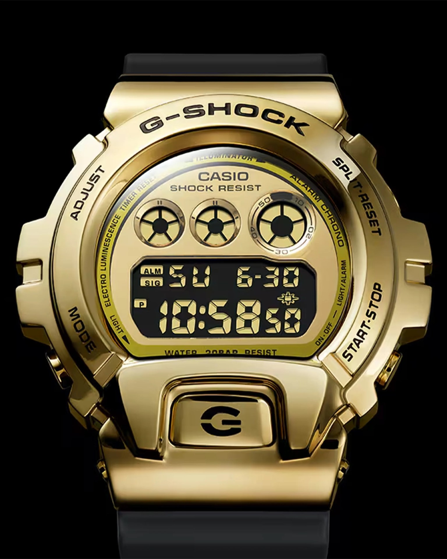 Gold Casio G-Shock digital watch with black strap and multiple function buttons on bezel.