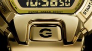Close-up of a gold digital watch face showing "10:30:50" with buttons labeled "MODE," "LIGHT," "ON-OFF," and "START.