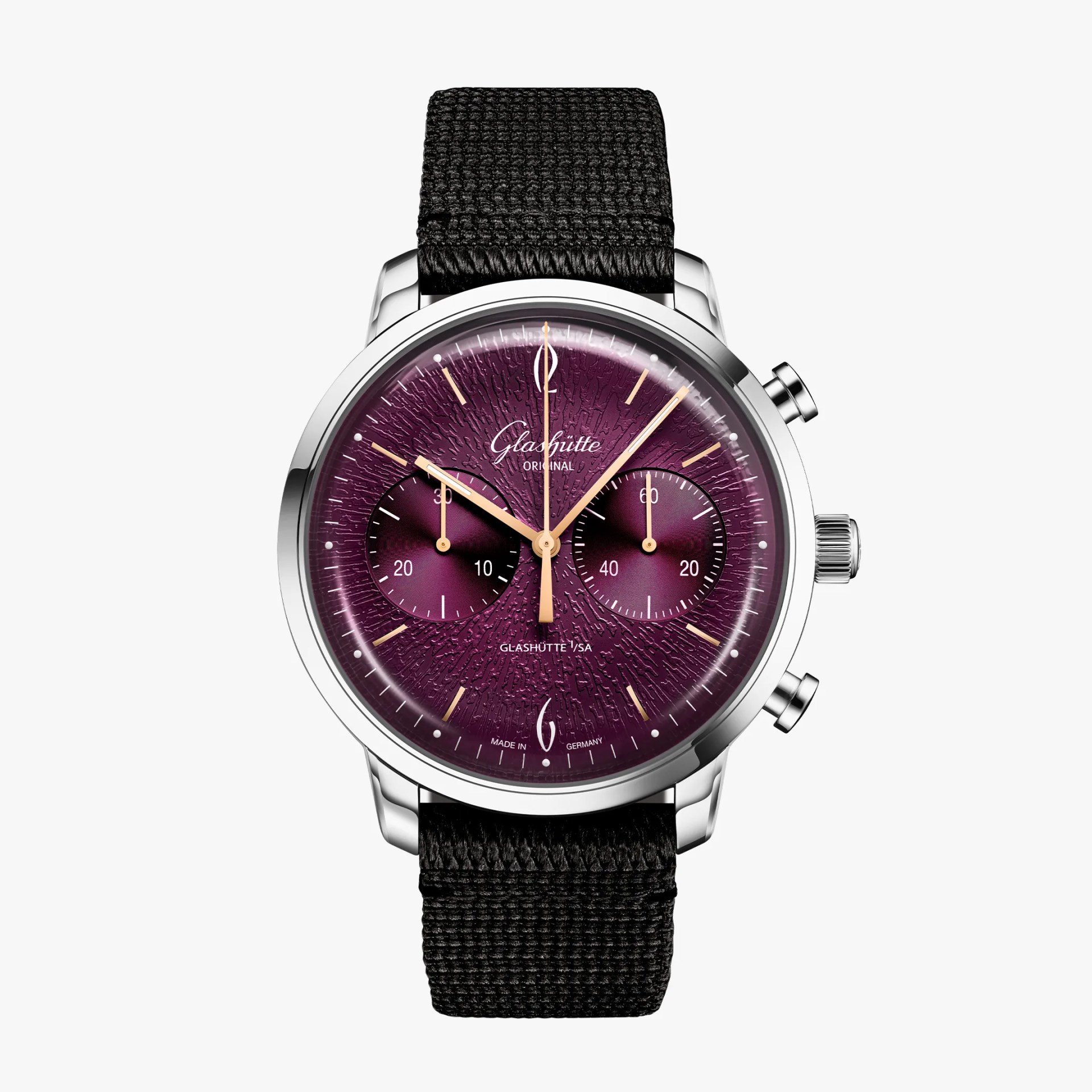 Silver watch with textured purple dial, gold hands, two subdials, and black woven strap.