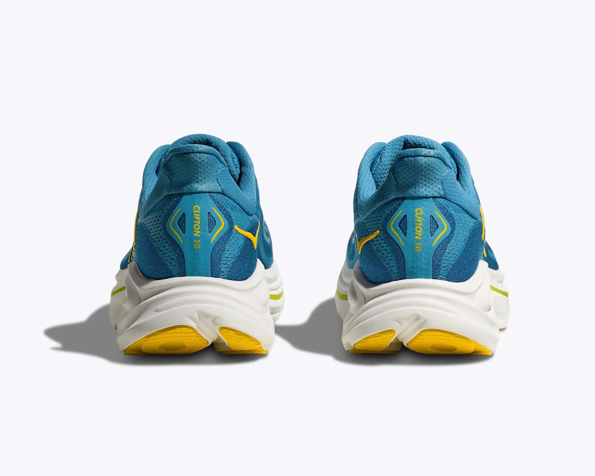 Pair of blue and yellow running shoes viewed from the back with white midsoles and yellow outsoles.
