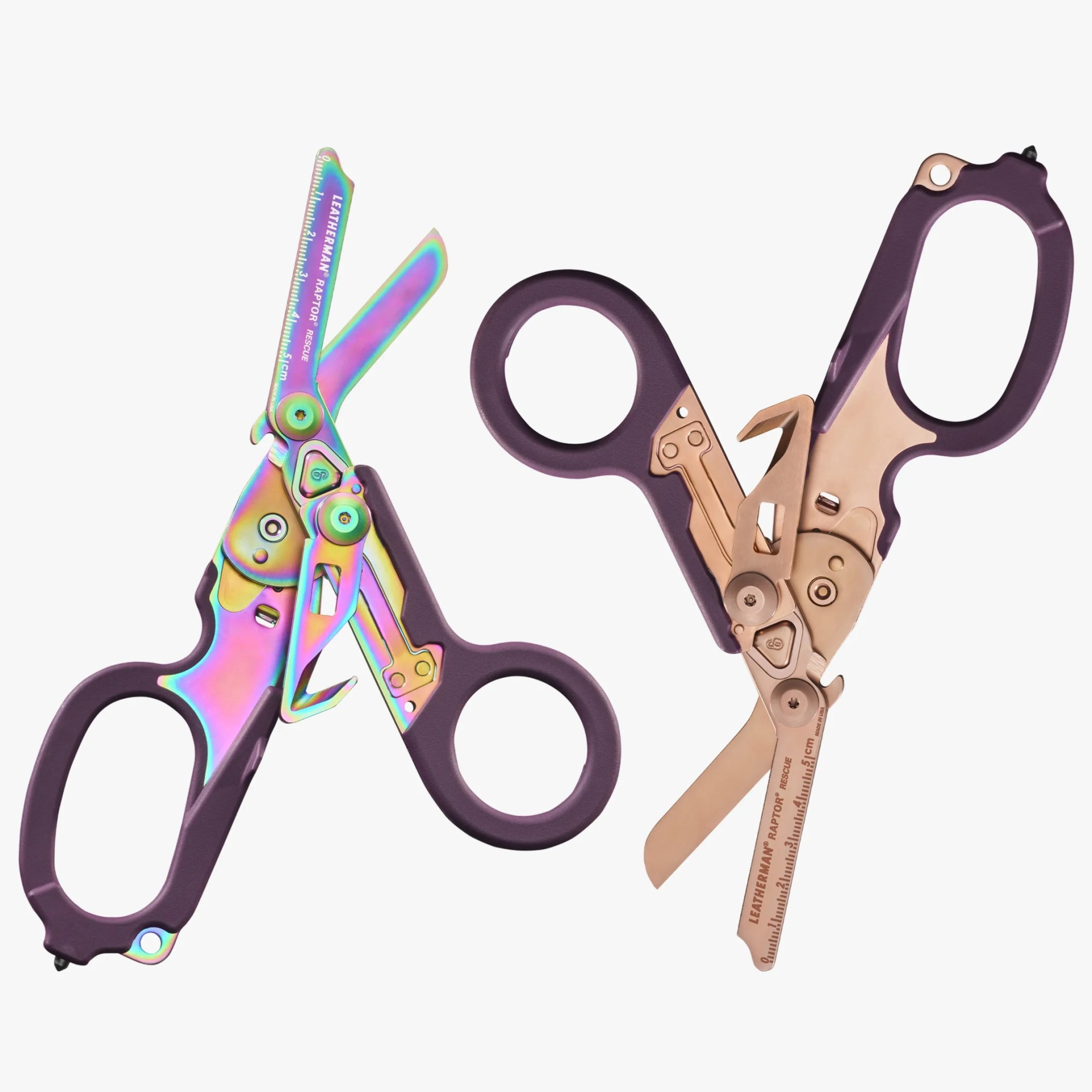 Pair of Leatherman Raptor Rescue scissors with purple handles and rainbow and rose gold metallic blades.