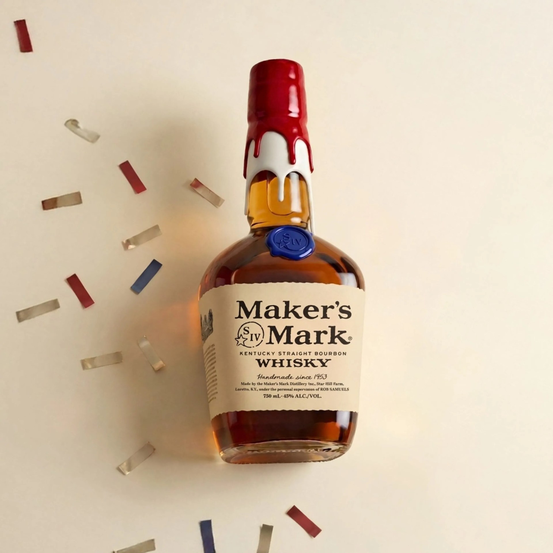 Bottle of Maker's Mark Kentucky Straight Bourbon Whisky with red wax seal on the neck and blue stamp on the bottle.
