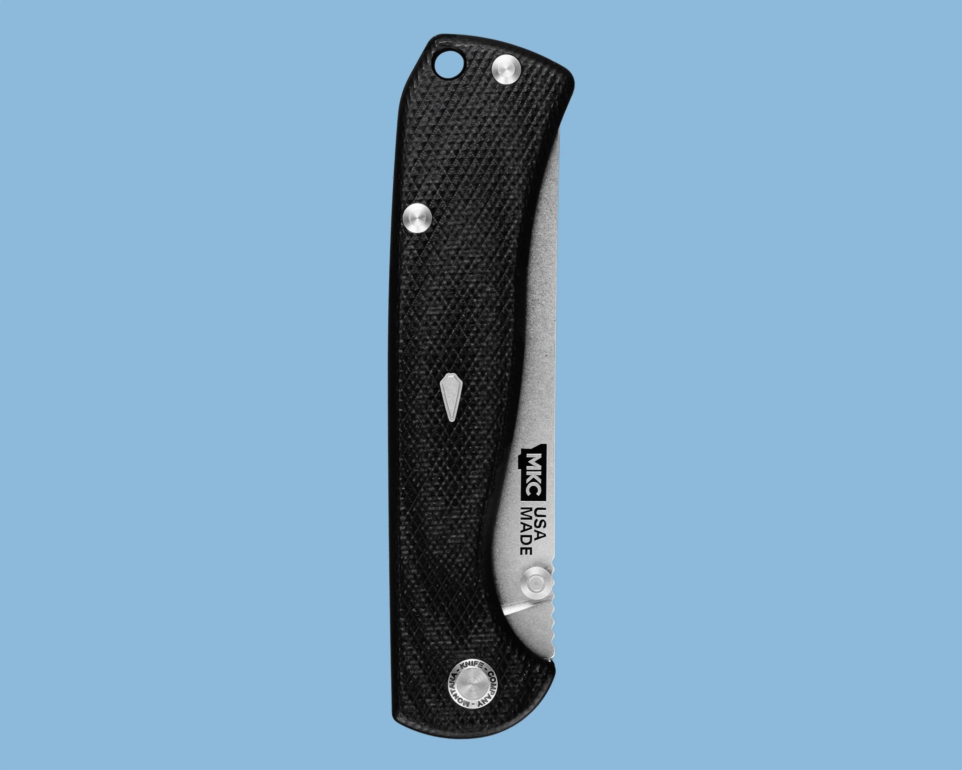 Black textured folding knife handle with partially visible silver blade and "USA MADE" text on blade.