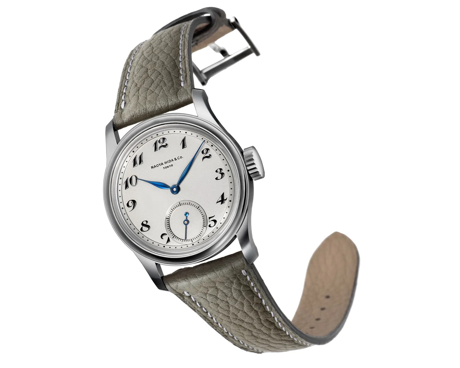 Silver wristwatch with white dial, blue hands, black Arabic numerals, and textured gray leather strap.