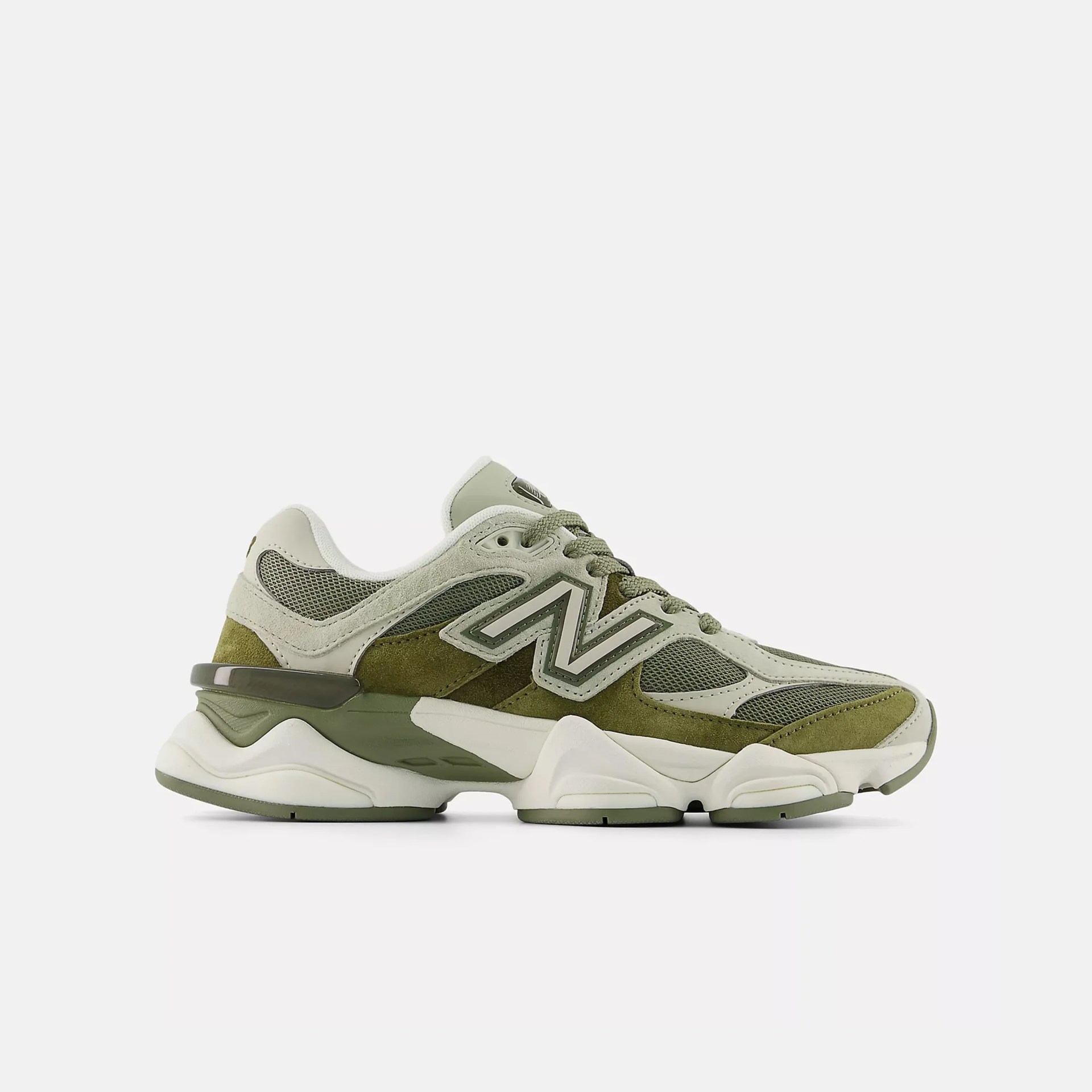 Olive green and beige New Balance sneaker with mesh and suede upper and chunky white sole.