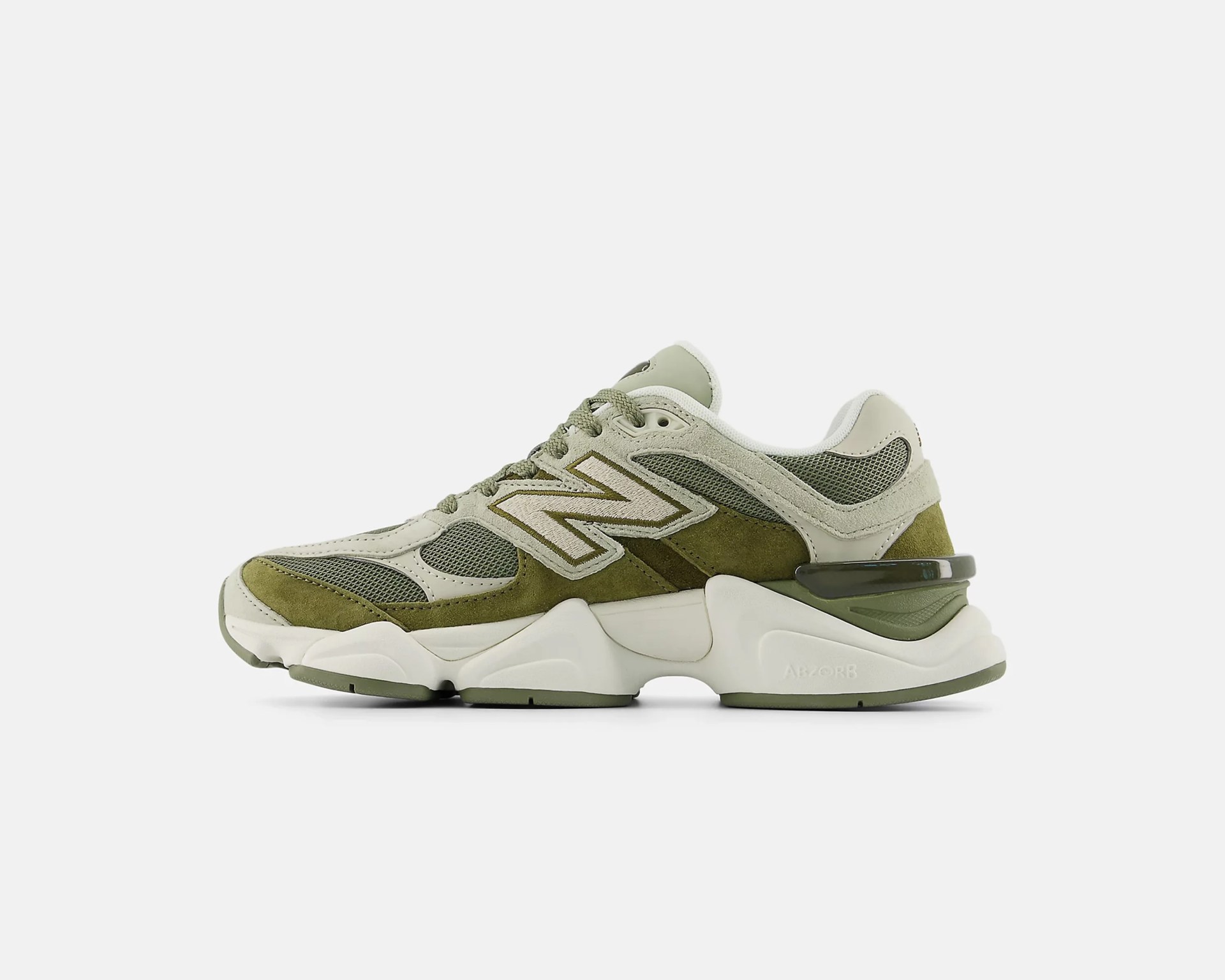 Olive green and beige New Balance sneaker with mesh and suede panels and chunky white sole.