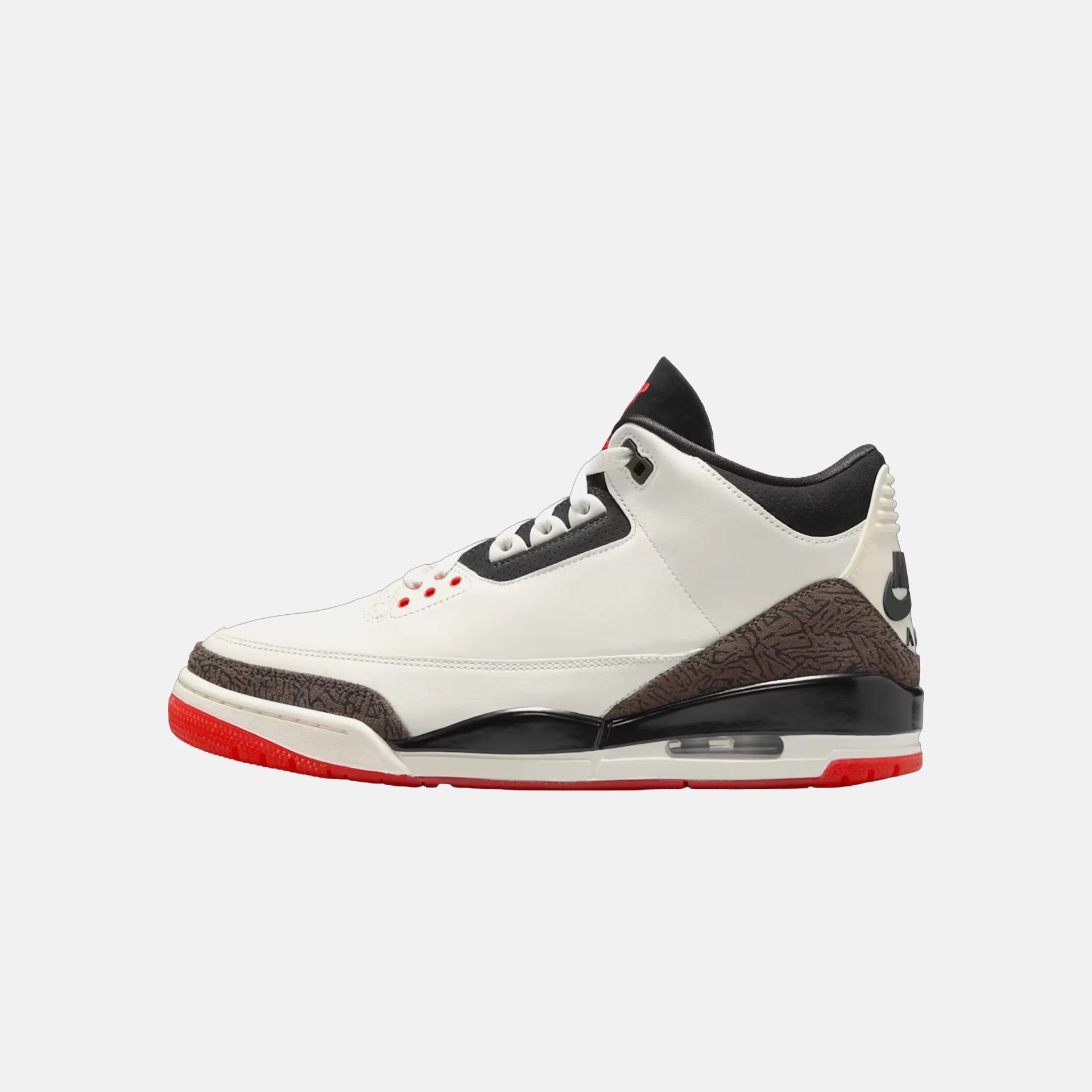 White and black high-top sneaker with red accents and textured brown detailing on the sole and heel.