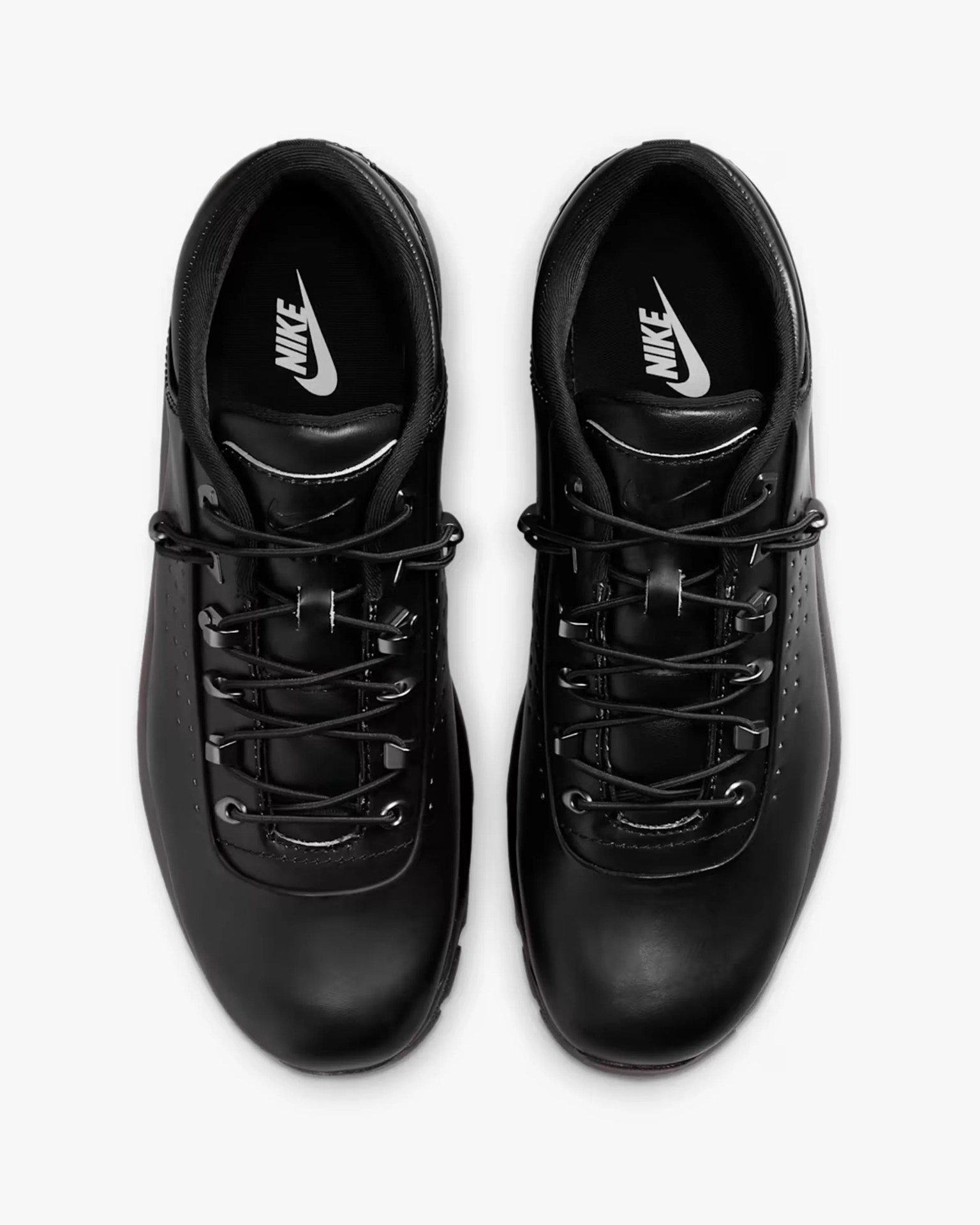 Black leather Nike sneaker with black laces and metal eyelets.