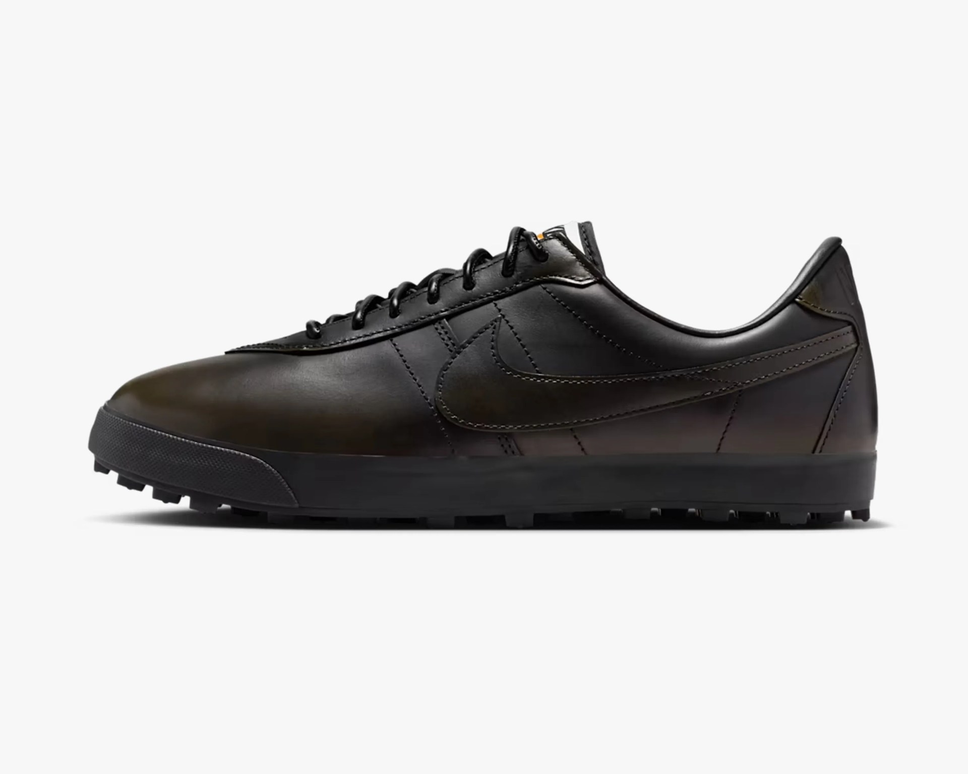 Black leather Nike sneaker with black laces and a textured black sole.