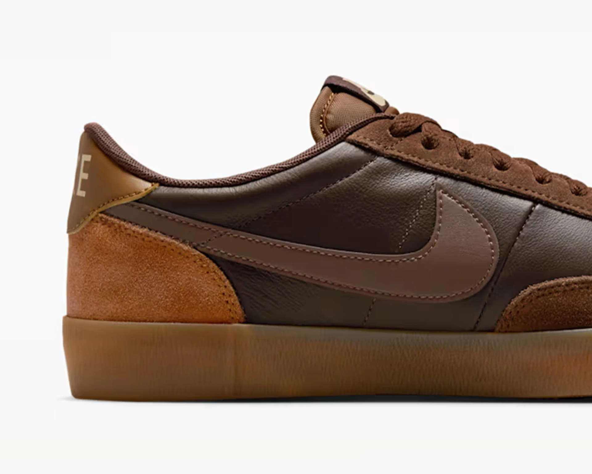 Brown leather and suede sneaker with gum sole and brown laces.