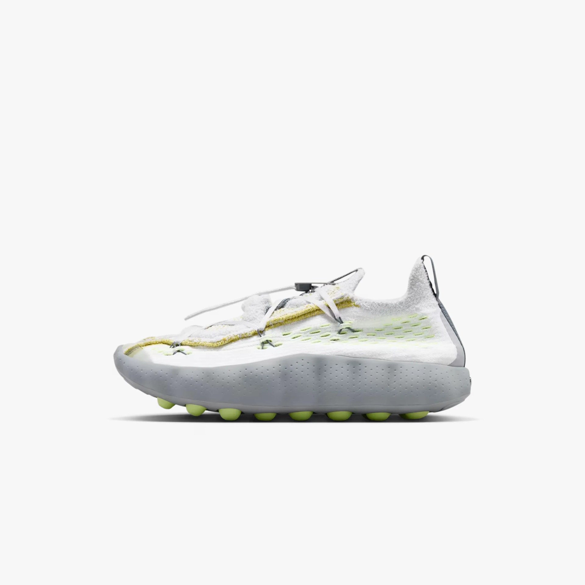White and light green athletic shoe with a textured upper and rounded sole studs.