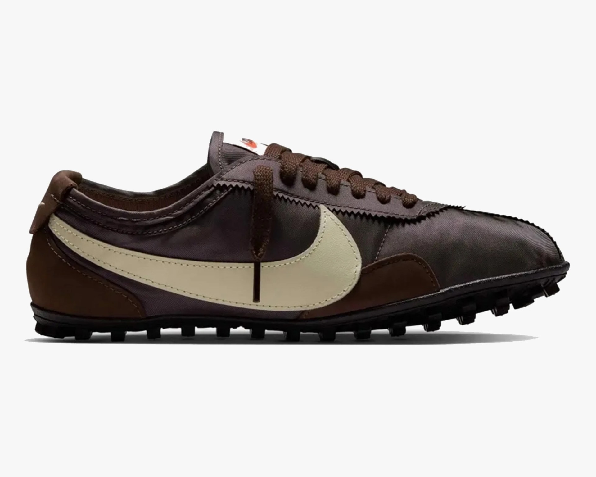 Brown and dark gray Nike sneaker with cream-colored swoosh and black sole.