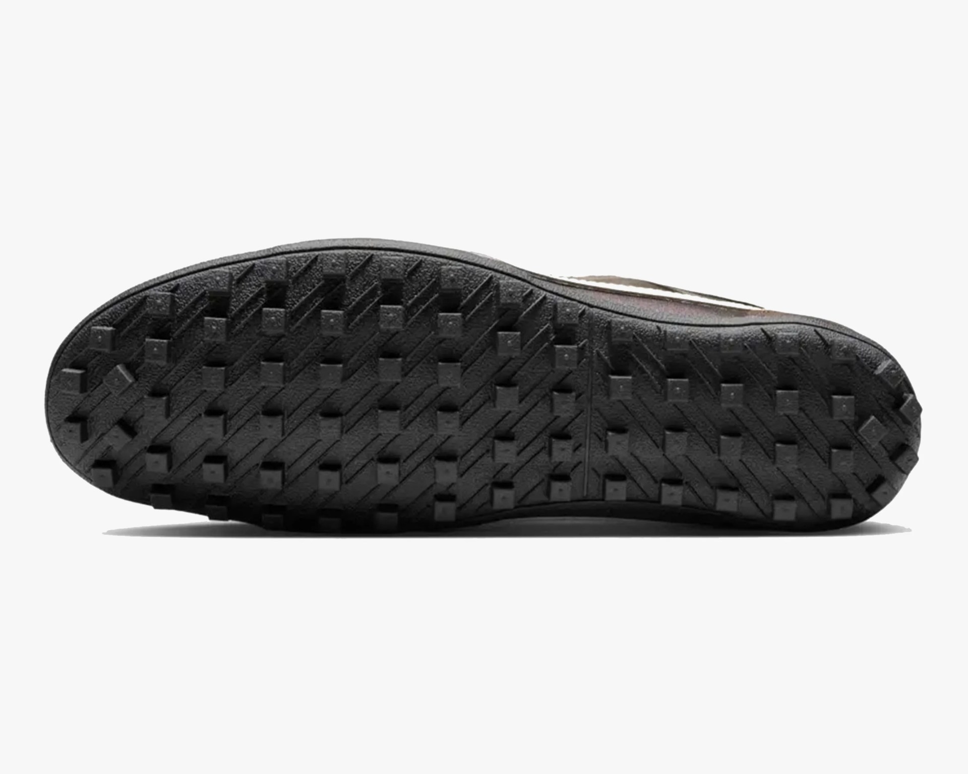 Black rubber shoe sole with square and diagonal tread pattern.