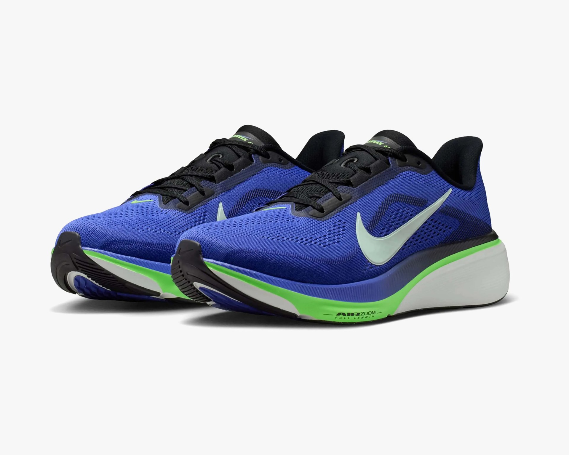 Pair of blue Nike Air Zoom running shoes with black laces and green accents on white soles.