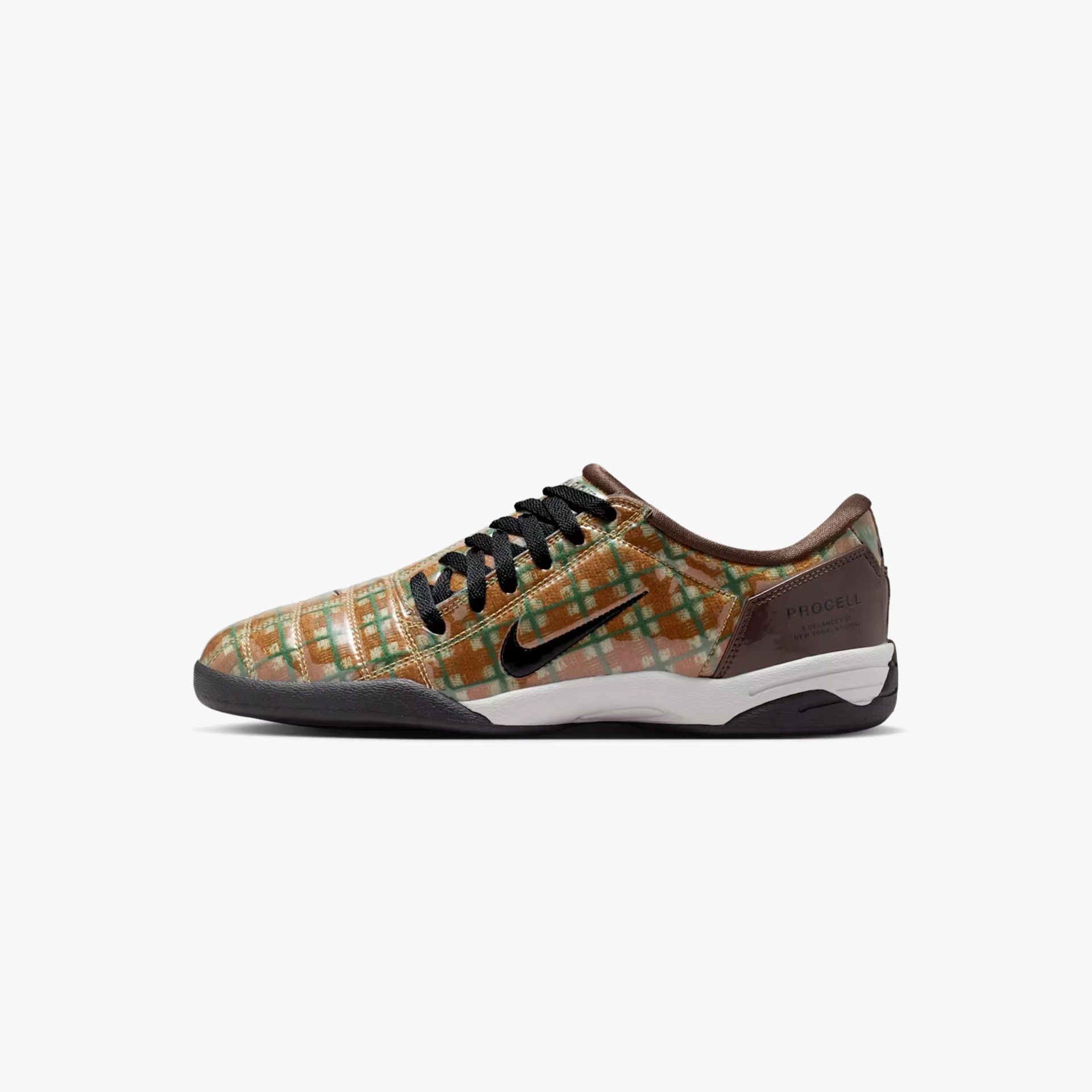 Low-top sneaker with a brown, green, and orange checkered pattern, black laces, and a white sole.