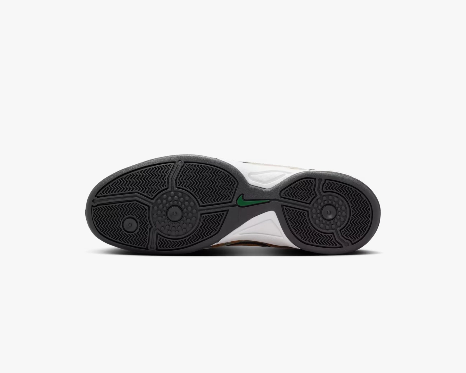 Black rubber outsole with circular traction patterns and a small green Nike swoosh logo.