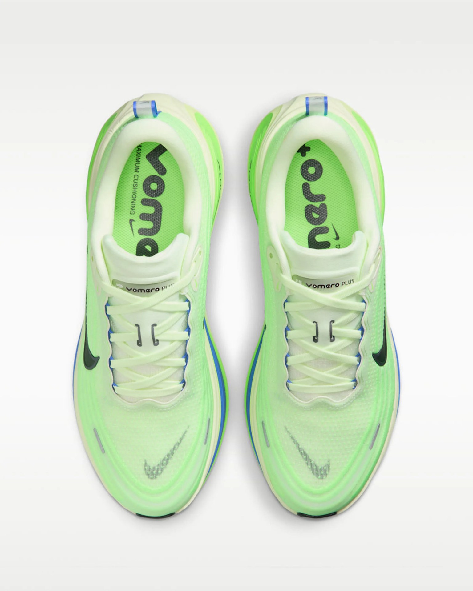 Pair of neon green Nike Vomero Plus running shoes viewed from above on a white background.