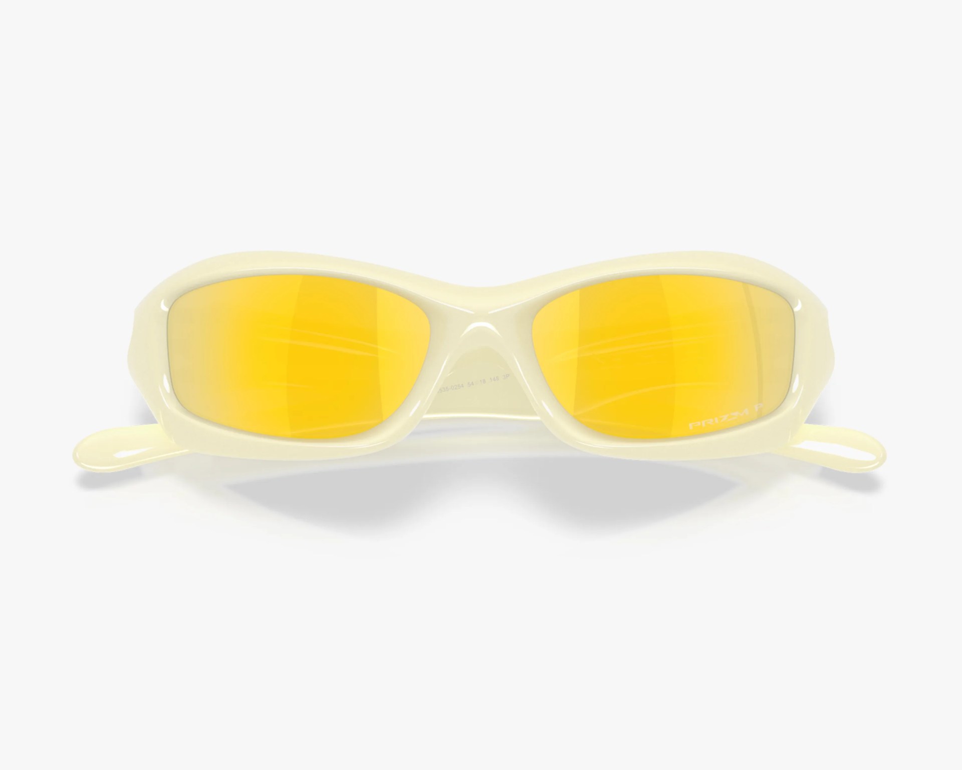 Cream-colored sunglasses with oval yellow mirrored lenses and a glossy finish.