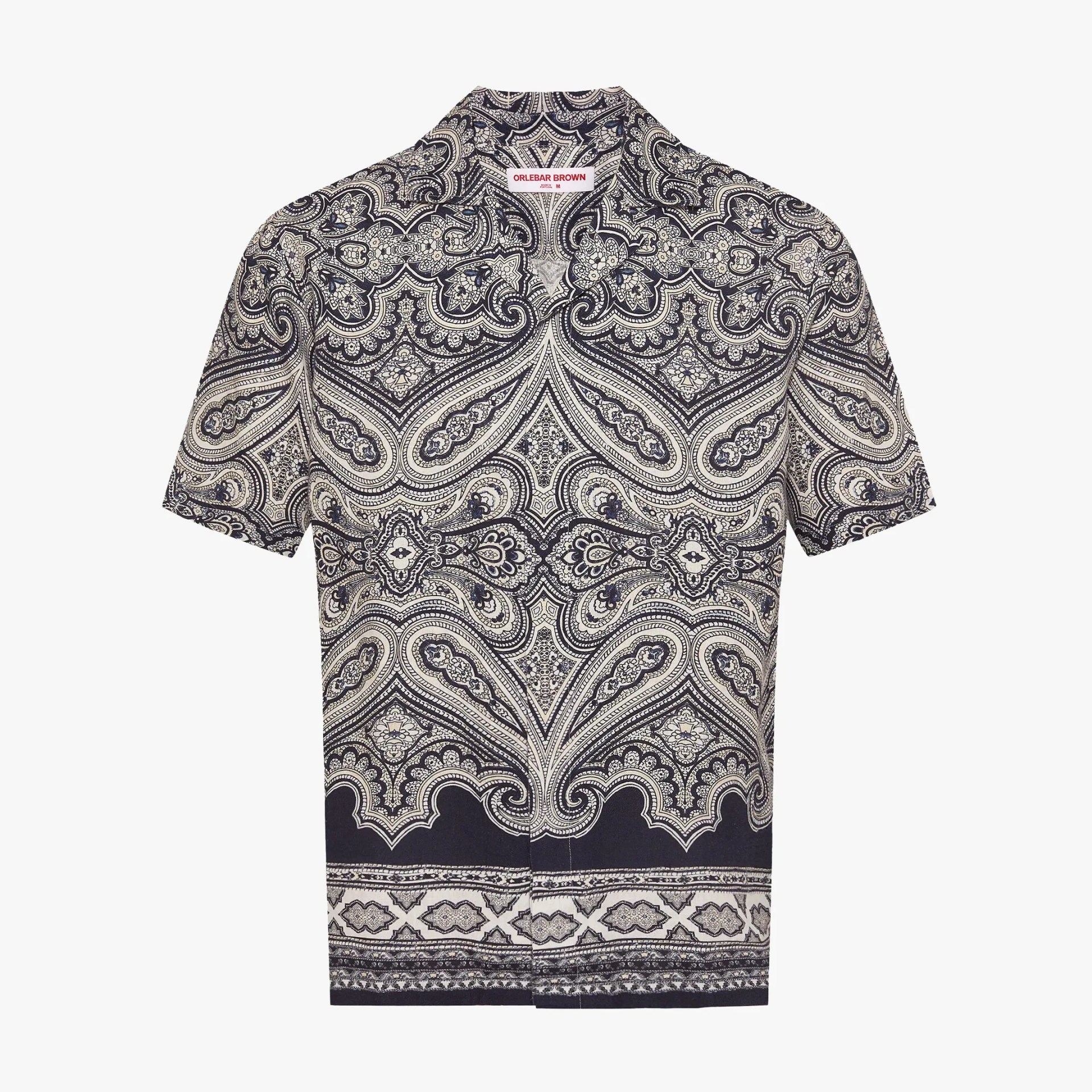 Short-sleeve shirt with intricate navy and white paisley pattern and a collar.