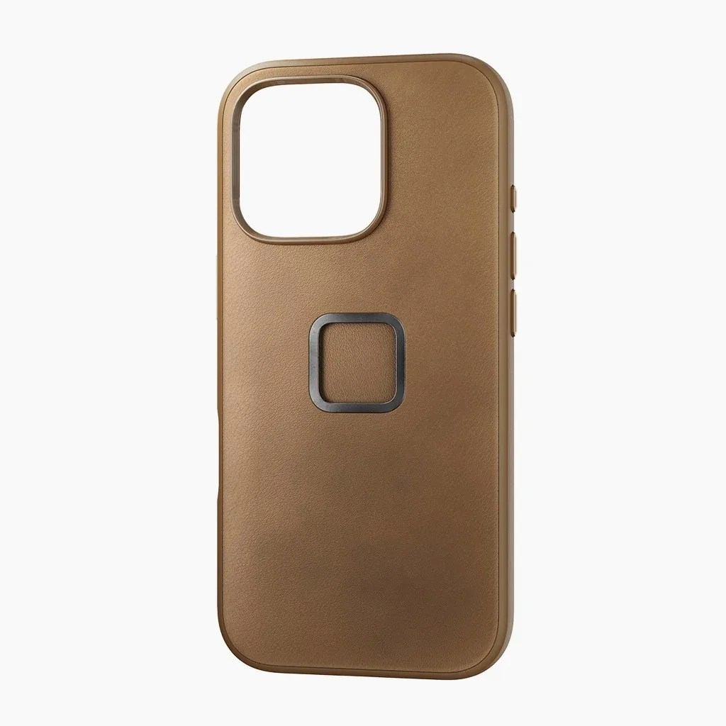 Brown leather phone case with a square metal ring on the back and a large camera cutout.