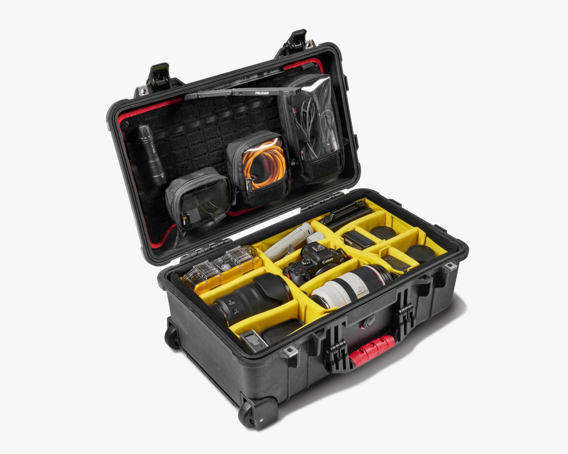 Black hard-shell Pelican case with yellow padded compartments holding camera gear and accessories.
