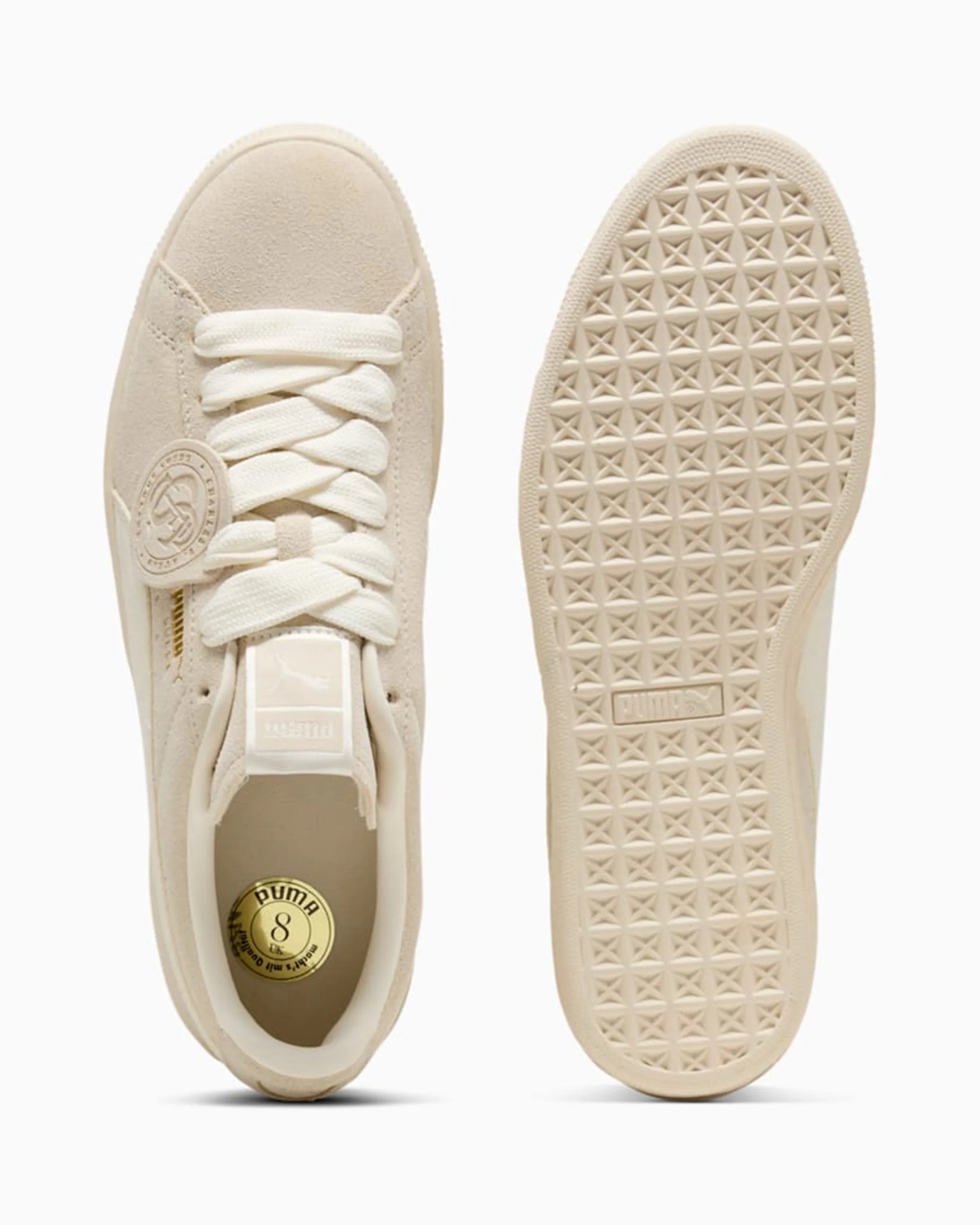 Beige suede Puma sneaker with white laces and textured sole shown from top and bottom.