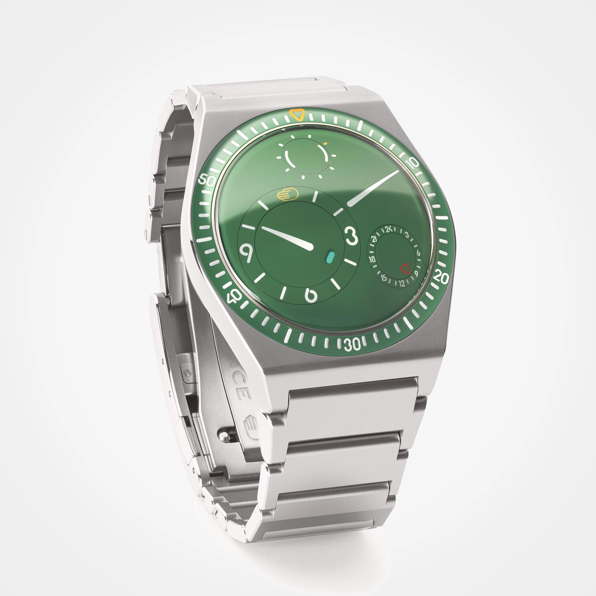 Silver metal wristwatch with a green dial featuring multiple subdials and a matching green bezel.