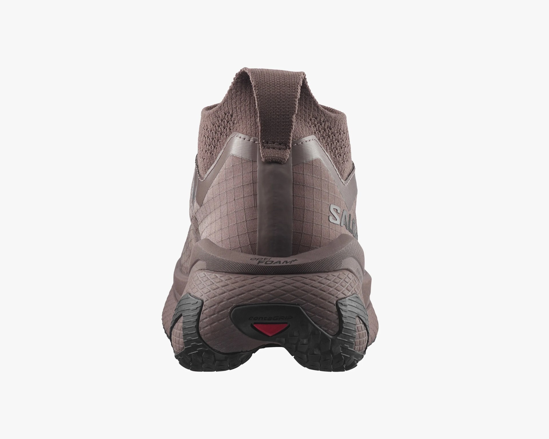 Back view of a taupe-colored athletic shoe with textured sole and pull tab on the heel.