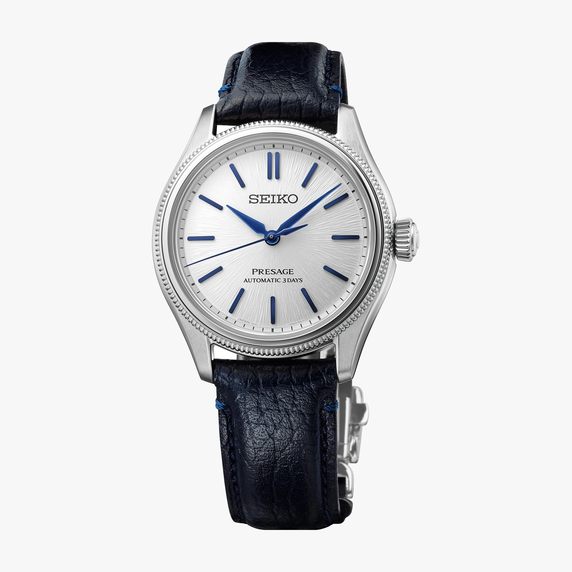 Silver Seiko Presage watch with blue hour markers and hands, black leather strap, and stainless steel case.