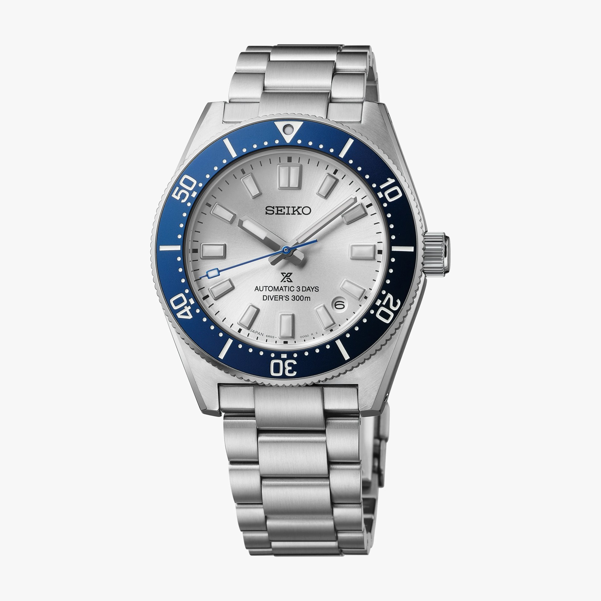 Silver Seiko diver's watch with blue bezel and stainless steel bracelet.