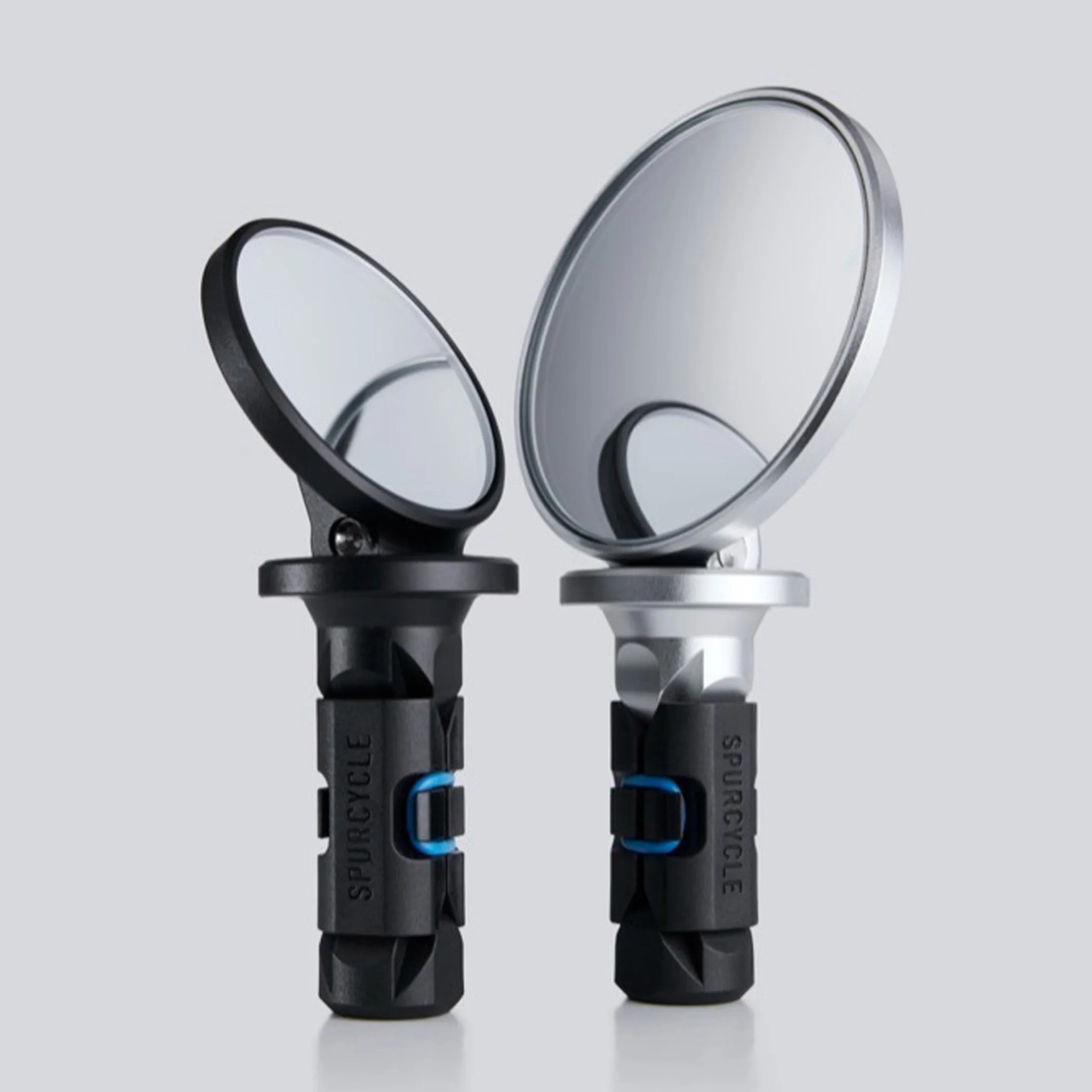 Two round motorcycle mirrors with black and silver frames and black mounting stems on a gray background.