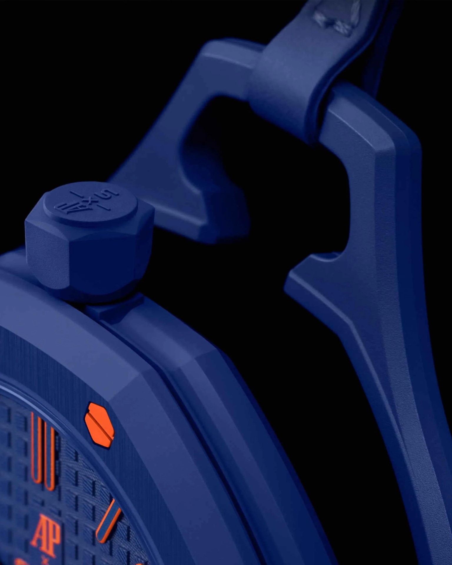 Close-up of a blue watch case with an orange screw and textured dial, featuring a blue strap attachment.