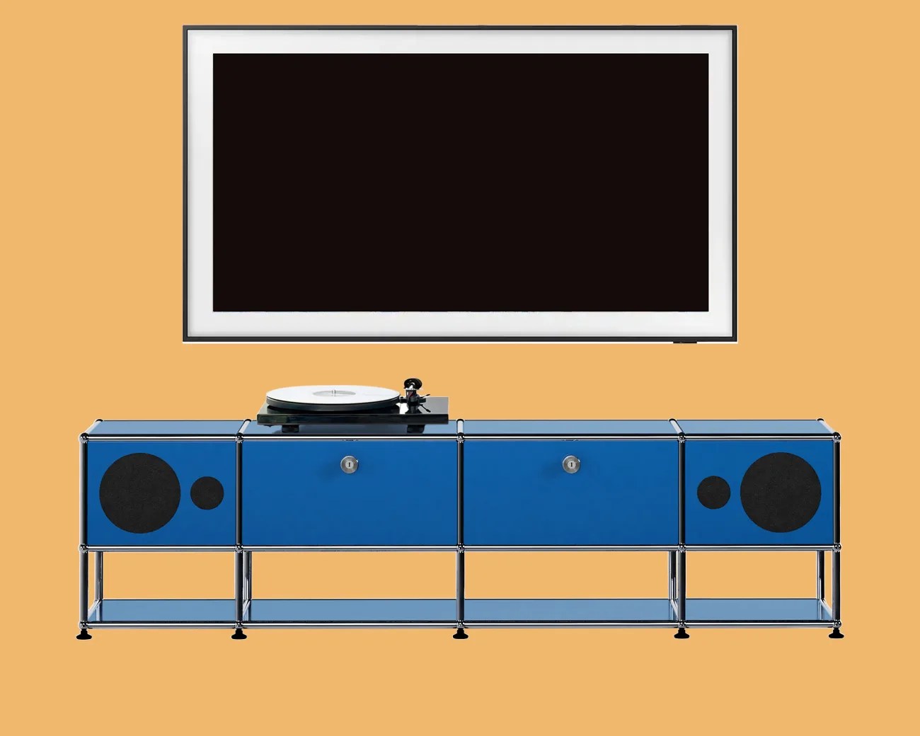 Blue modular media console with chrome frame, built-in speakers, and a black turntable on top, below a wall-mounted flat-screen TV.
