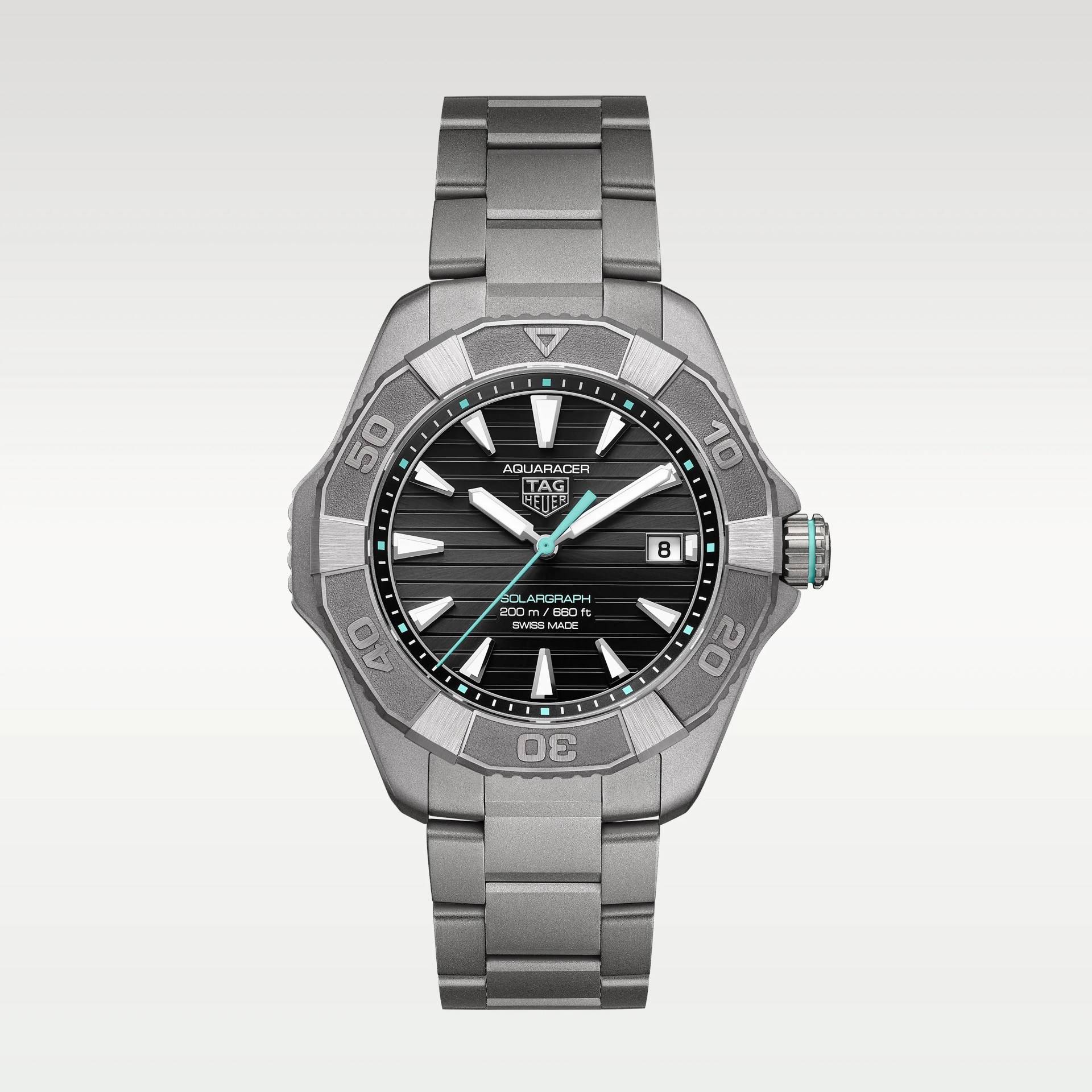 Titanium TAG Heuer Aquaracer watch with black dial, silver markers, date window, and turquoise accents.