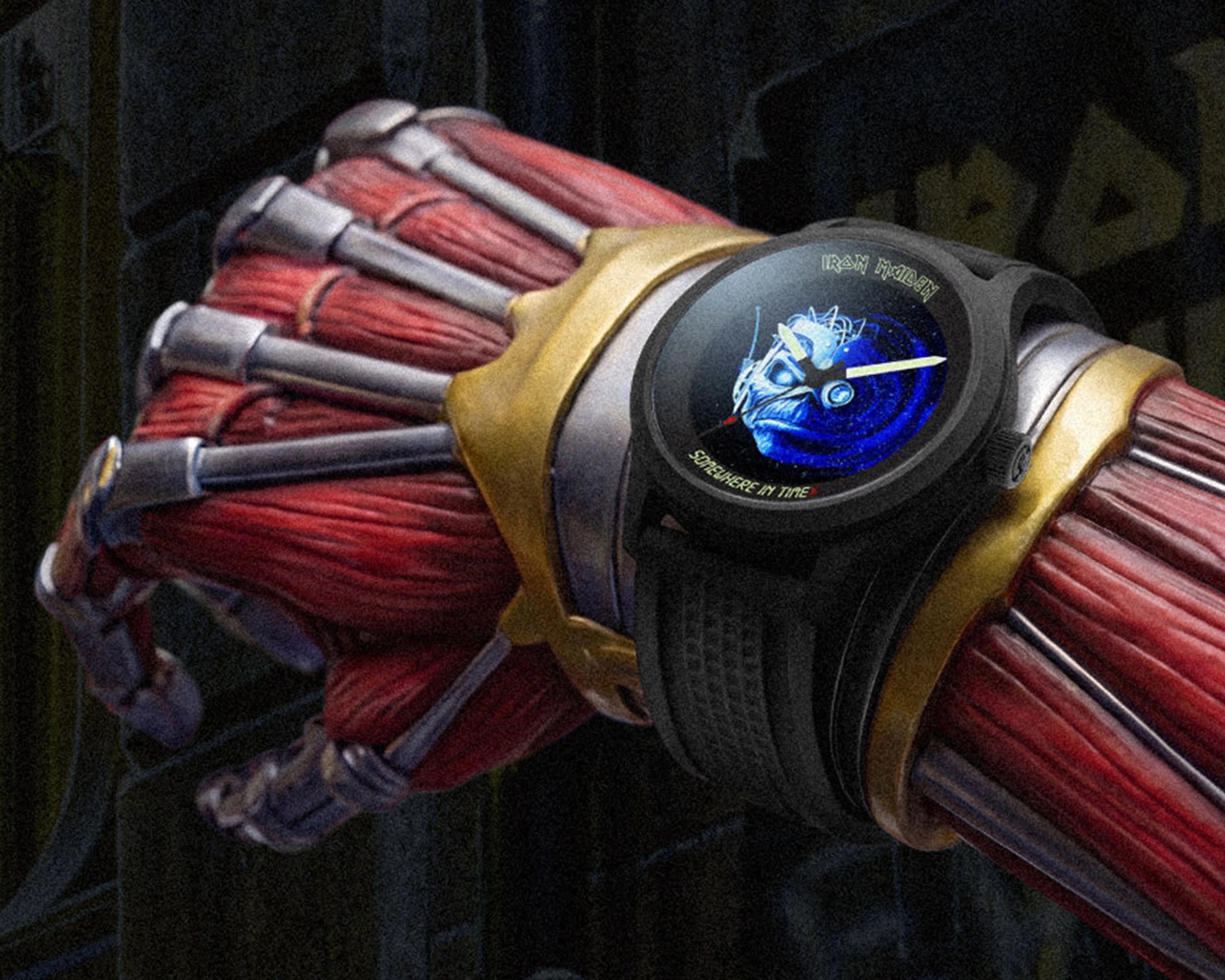 Mechanical arm with exposed red muscles wearing a black Iron Maiden "Somewhere in Time" watch.
