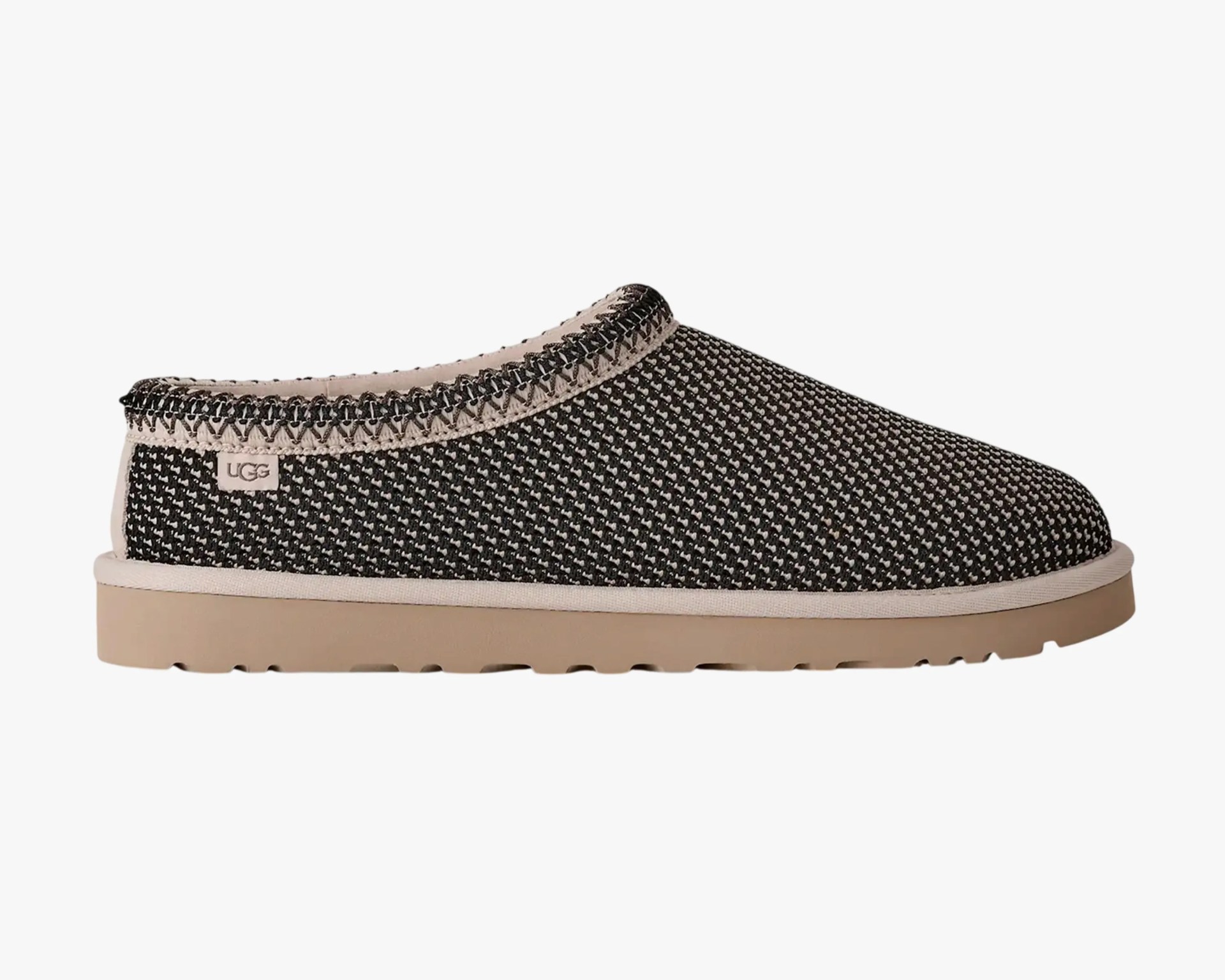 Black and beige woven UGG slip-on shoe with beige sole and stitched trim.