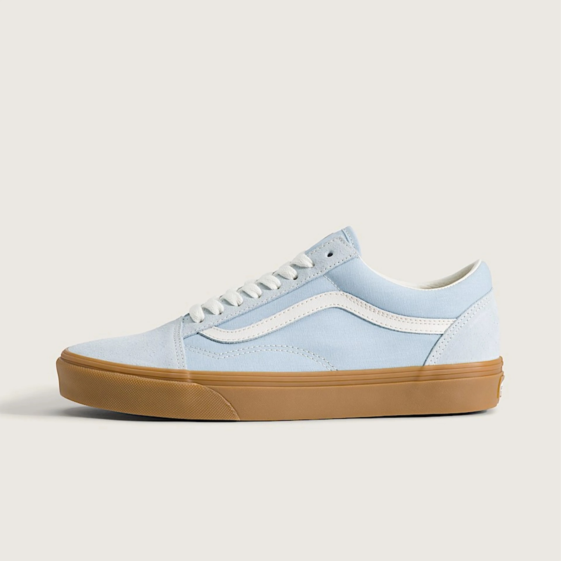 Light blue suede and canvas sneaker with white side stripe and gum rubber sole.