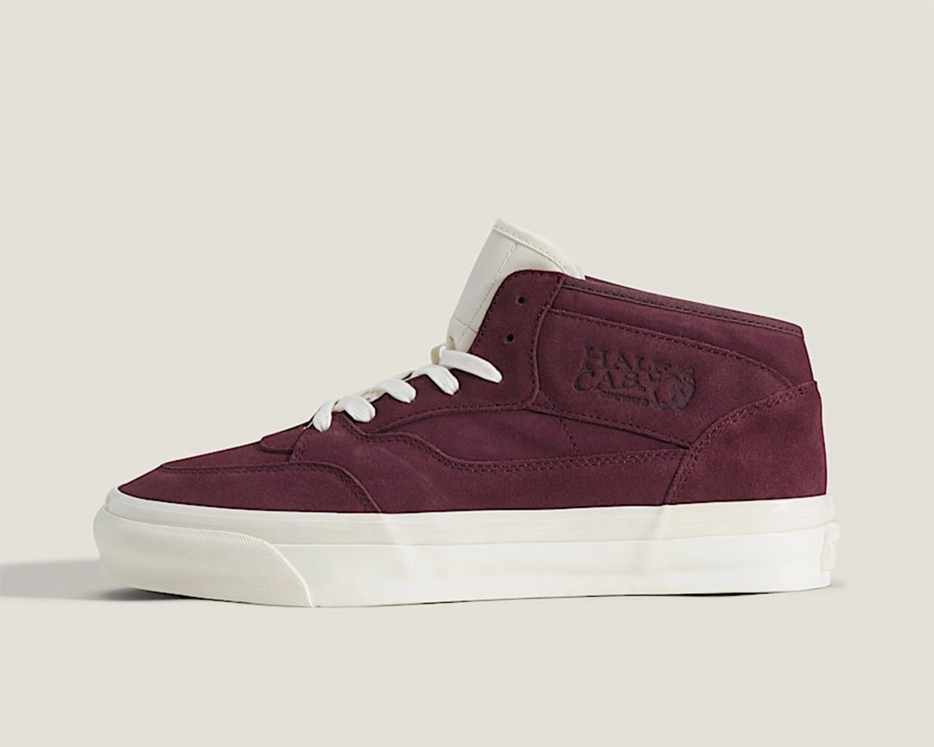 Maroon suede high-top sneaker with white laces and sole, featuring embossed "HALF CAB" logo on the side.